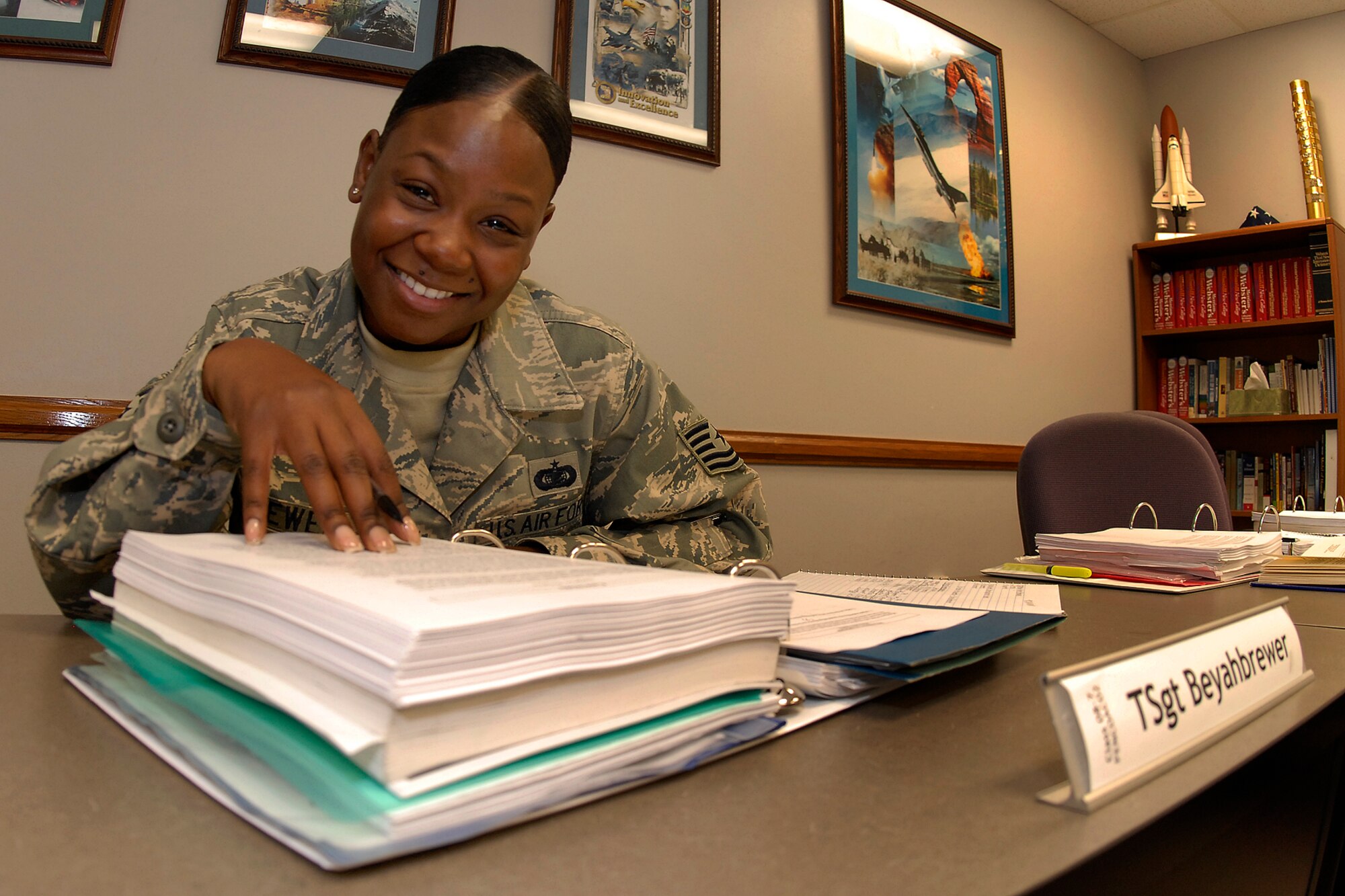 Tech. Sgt Ameerah Beyah-Brewer, a client support administrator at 4 AF, hits the books at a class she is attending at the NCO Academy at Peterson AFB, Colo. on
Tuesday. The Moreno Valley Chamber honored her for her military service. (U.S. Air Force photo by Rob Bussard)
