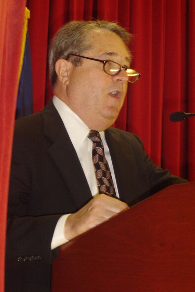 Guest speaker Michael Goldware talks to an audience about three POWs from Vietnam. (U.S. Air Force photo by Will Alexander, 452 AMW)