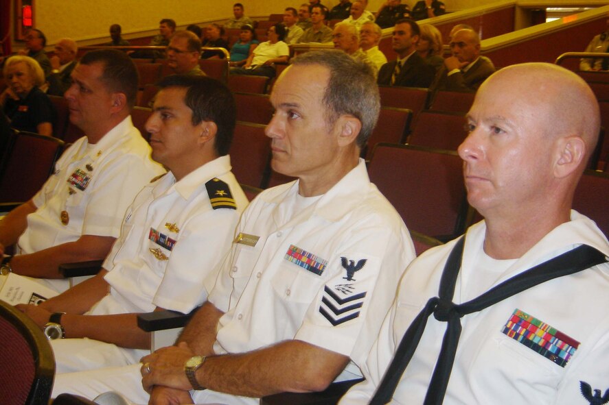 Sailors listen to guest speaker Michael Goldware. (U.S. Air Force photo by Will Alexander, 452 AMW)