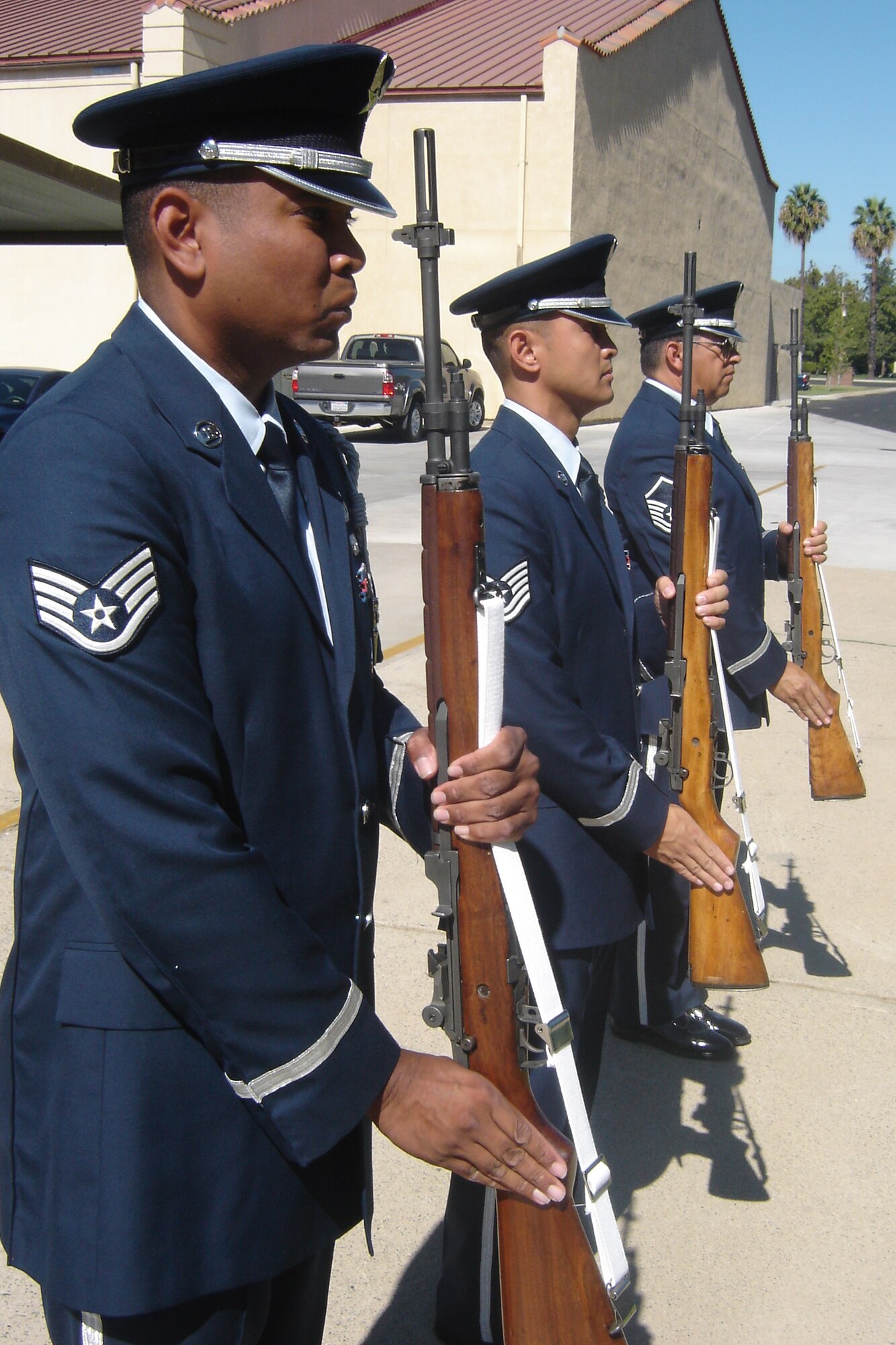 A firing party from the Honor Guard recovers after a firing salute. (Left to right)
Staff Sgt. Keith Lawson, Tech. Sgt. Neil Ballecer, and Master Sgt. Robert Carreon.(U.S. Air Force photo by Will Alexander, 452 AMW)