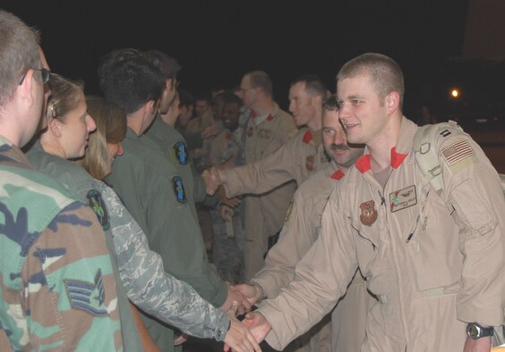 Members of the 20th Special Operations Squadron are greeted as they return home from the squadron's final deployment at a ceremony here Oct. 3. The final mission for the 20th SOS, which flies the MH-53 Pave Low helicopter, took place Sept. 26 in Iraq. The aircraft will be retired and the squadron will be deactivated Oct. 17. (U.S. Air Force photo/ Captain Nathan Davidson)