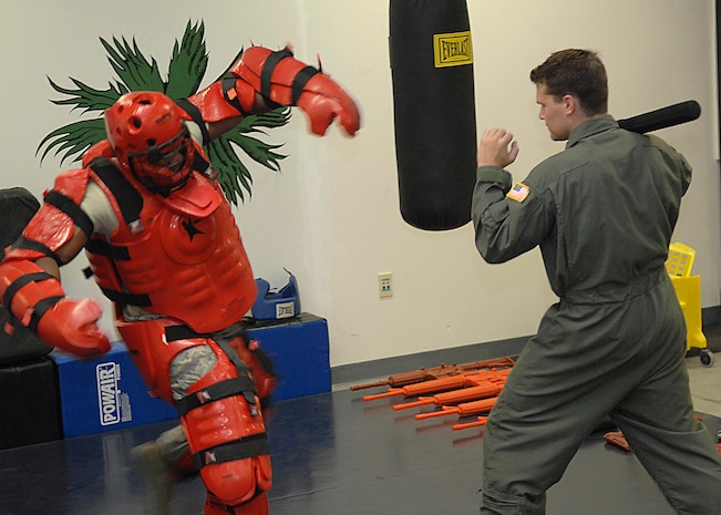 Staff Sgts.Toma Ferguson, left, and Daniel Sherrill, right, practice baton techniques on Charleston AFB Oct. 8. Security Forces Ravens fly with aircraft to maintain security when aircraft are going to be landing in areas where the security level is unknown or additional security is needed. Sergeants Ferguson and Sherrill are Ravens with the 437th Security Forces Squadron. (U.S. Air Force photo/Airman 1st Class Katie Gieratz)