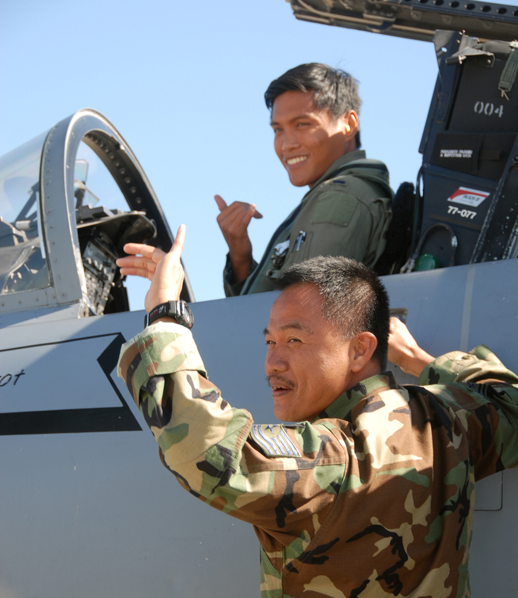 WILLIAMTOWN, AUSTRALIA --  Father, Tech. Sgt. Marconi Cabatbat Sr.,154th Logistics Readiness Squadron and son, 1st Lt. Marconi Cabatbat Jr., 199th Fighter Squadron,deploy together for the first time during Sentry Down Under 2008 held Sept. 3 - 22 in Williamtown, Australia. Tech. Sgt. Cabatbat has another son, Jason, who is also a member of the 154th Wing.
