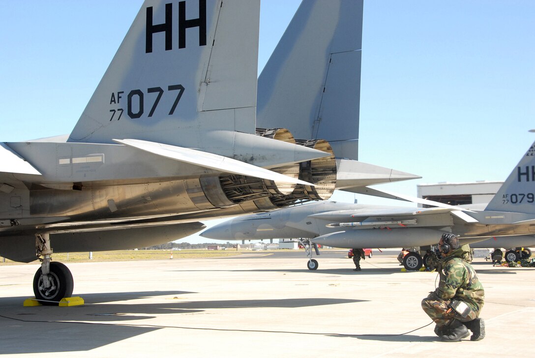 WILLIAMTOWN, AUSTRALIA -- A 154th Wing Maintenance Airman checks control surface operations during a pre-flight check during the second day of operations of Sentry Down Under in Williamtown, Australia.