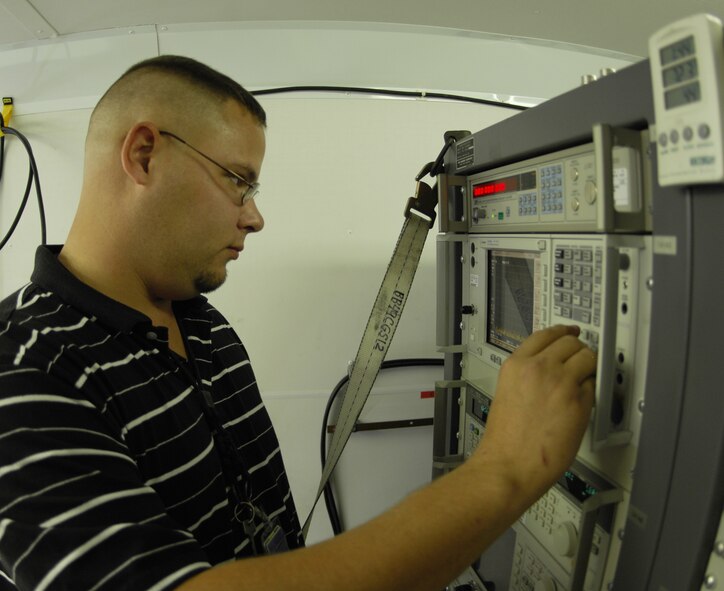 Josh Westerfield, 49th Test and Evaluation Squadron, monitors the recording devices used on the B-52 to track the communication throughout the aircraft and weapon.  This equipment is installed specifically for the Nuclear Weapon System Evaluation Program by the 49th TES.  Photo by Senior Airman Joe Rivera.