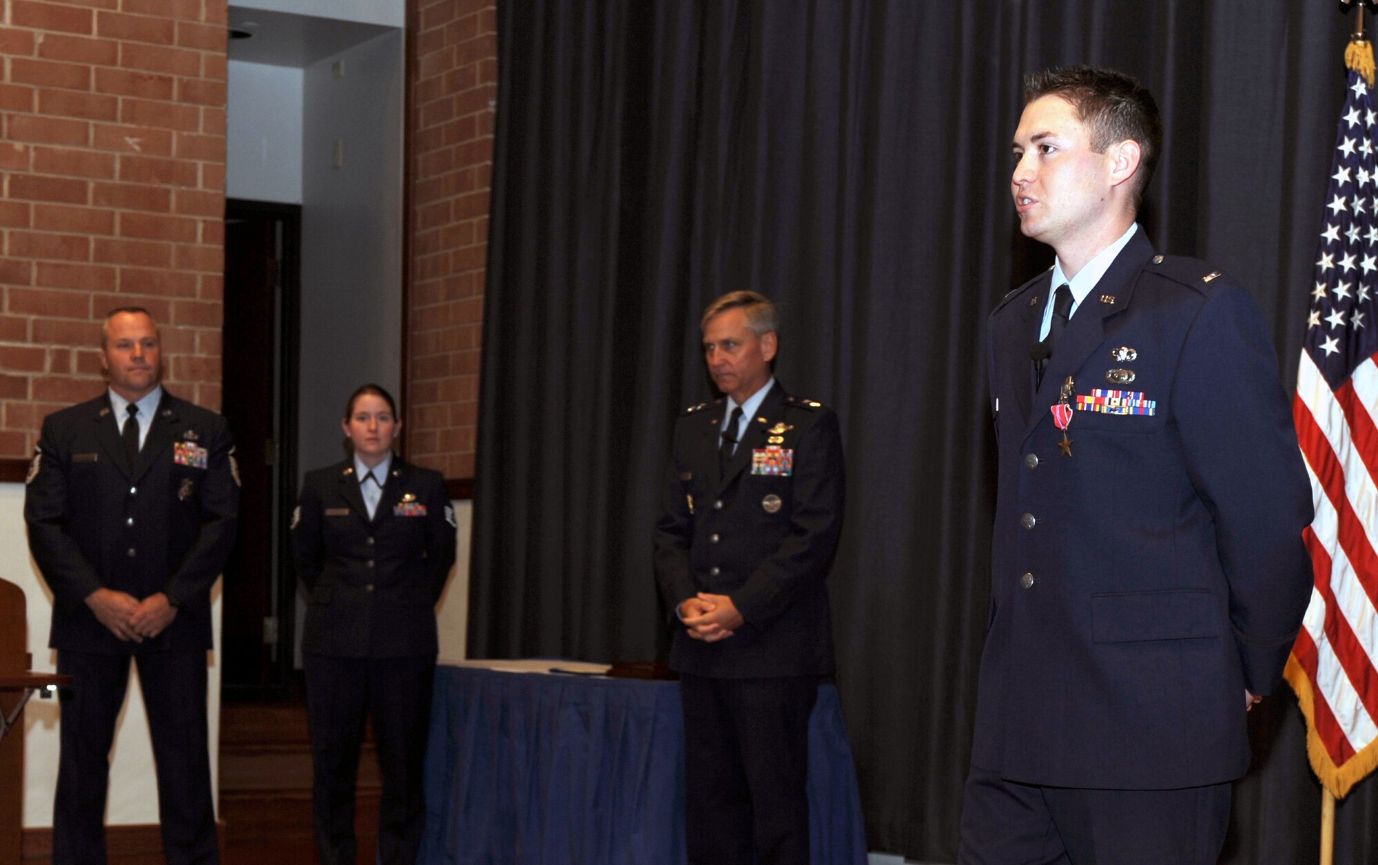 First Lt. Eric Snelgrove, 421st Combat Training Squadron intelligence flight commander, talks to the audience after receiving the Bronze Star during an awards ceremony in the U.S. Air Force Expeditionary Center on Fort Dix, N.J., Sept. 24, 2008.  Lieutenant Snelgrove earned the Bronze Star for a deployment to Iraq in 2007.  Maj. Gen. Kip Self, Expeditionary Center commander, presented him with the award.  (U.S. Air Force Photo/Staff Sgt. Nathan Bevier)