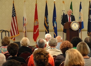 Retired Col. Jerry Musselman gives opening remarks before the beginning of the Charleston AFB and Naval Weapons Station Charleston Military Retiree and Spouse Appreciation Day Oct. 4 at the Charleston Club. More than 250 retirees and family members from the local area attended event. Mr. Musselman is the Dorchester Interfaith Outreach Ministries board chairman (U.S. Air Force photo/Master Sgt. Paul Kilgallon)