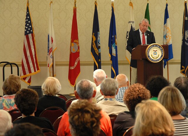 Retired Col. Jerry Musselman gives opening remarks before the beginning of the Charleston AFB and Naval Weapons Station Charleston Military Retiree and Spouse Appreciation Day Oct. 4 at the Charleston Club. More than 250 retirees and family members from the local area attended event. Mr. Musselman is the Dorchester Interfaith Outreach Ministries board chairman (U.S. Air Force photo/Master Sgt. Paul Kilgallon)