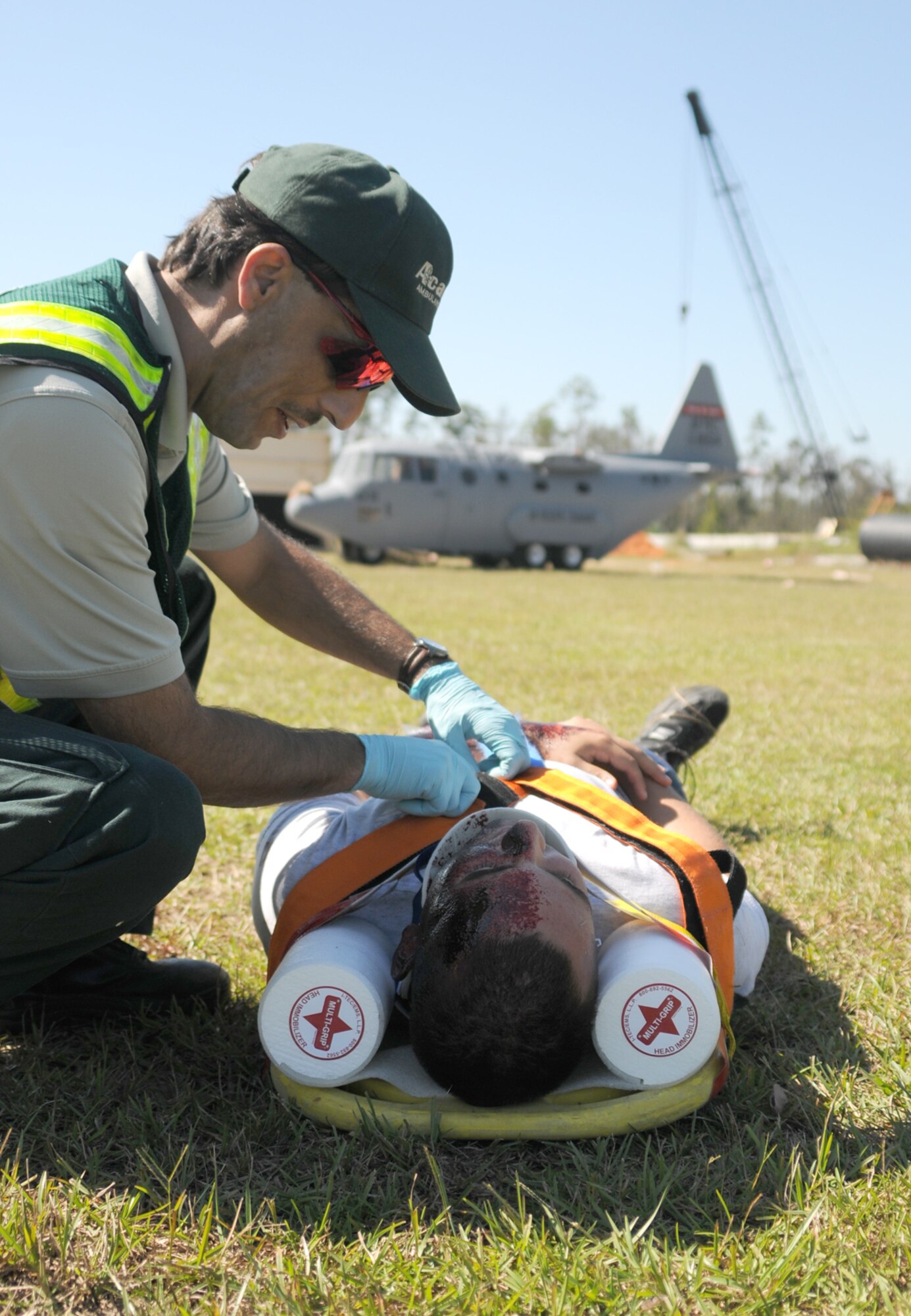 Paramedic Scott Haner, Acadian Medical Service, treats Airman Basic Jonathan Jordan, 334th Training Squadron, injured in the accident.  Other off-base participants included the Jackson County Emergency Operations Center, Mississippi Emergency Management Agency, Jackson County Sheriff’s Department, BP, Vancleave Volunteer Fire Department and American Red Cross.  (U.S. Air Force photo by Kemberly Groue)