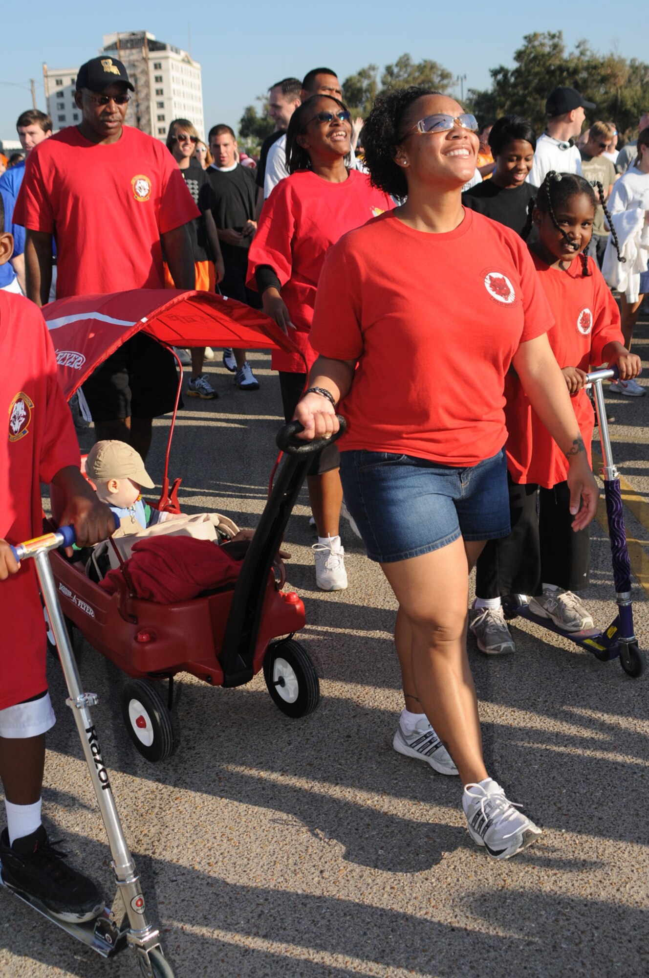 Staff Sgt. Felicia Simpson pulls her 1-year-old son, Joseph, in a wagon followed by Master Sgt. Lee Young, left, Senior Master Sgt. Nicole Watkins and 8-year-old SaVena Watkins in Saturday’s 4-mile Mississippi Gulf Coast Heart Walk in Gulfport.  The sergeants from the 336th Training Squadron were among 528 Keesler walkers who contributed more than $17,170 to the American Heart Association’s annual event and received the bronze medal for third place fundraising team.  Last year, 230 walkers from the base raised $9,421 for the cause.  Overall, more than 7,000 walkers raised $450,000 this year.  (U.S. Air Force photo by Kemberly Groue)