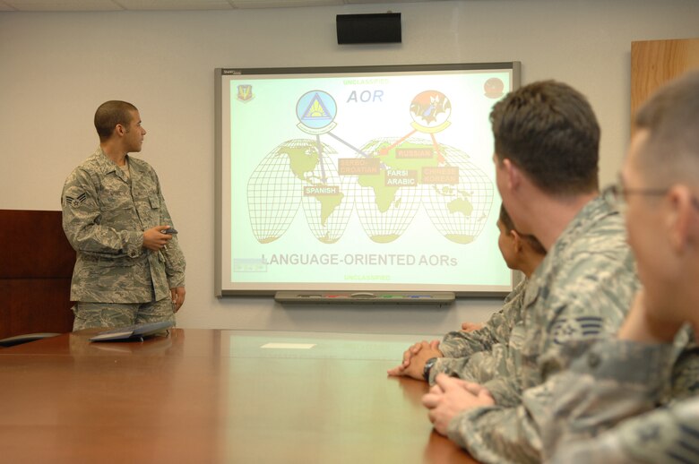 Senior Amn Derrick Love, 755th Operations Support Squadron intelligence operations, briefs personnel on Compass Call capabilities here, September 25. (U.S. Air Force photo/Senior Airman Noah R. Johnson)
