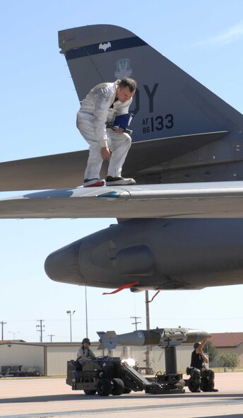 DYESS AIR FORCE BASE, Texas —  Crew members and weapon loaders for the B -1 bomber work to conduct proper maintenance procedures and weapons loading to effectively launch the aircraft during a Phase 1 Operational Readiness Inspection here Oct. 5. (U.S. Air Force photo/Senior Airman Domonique Simmons)