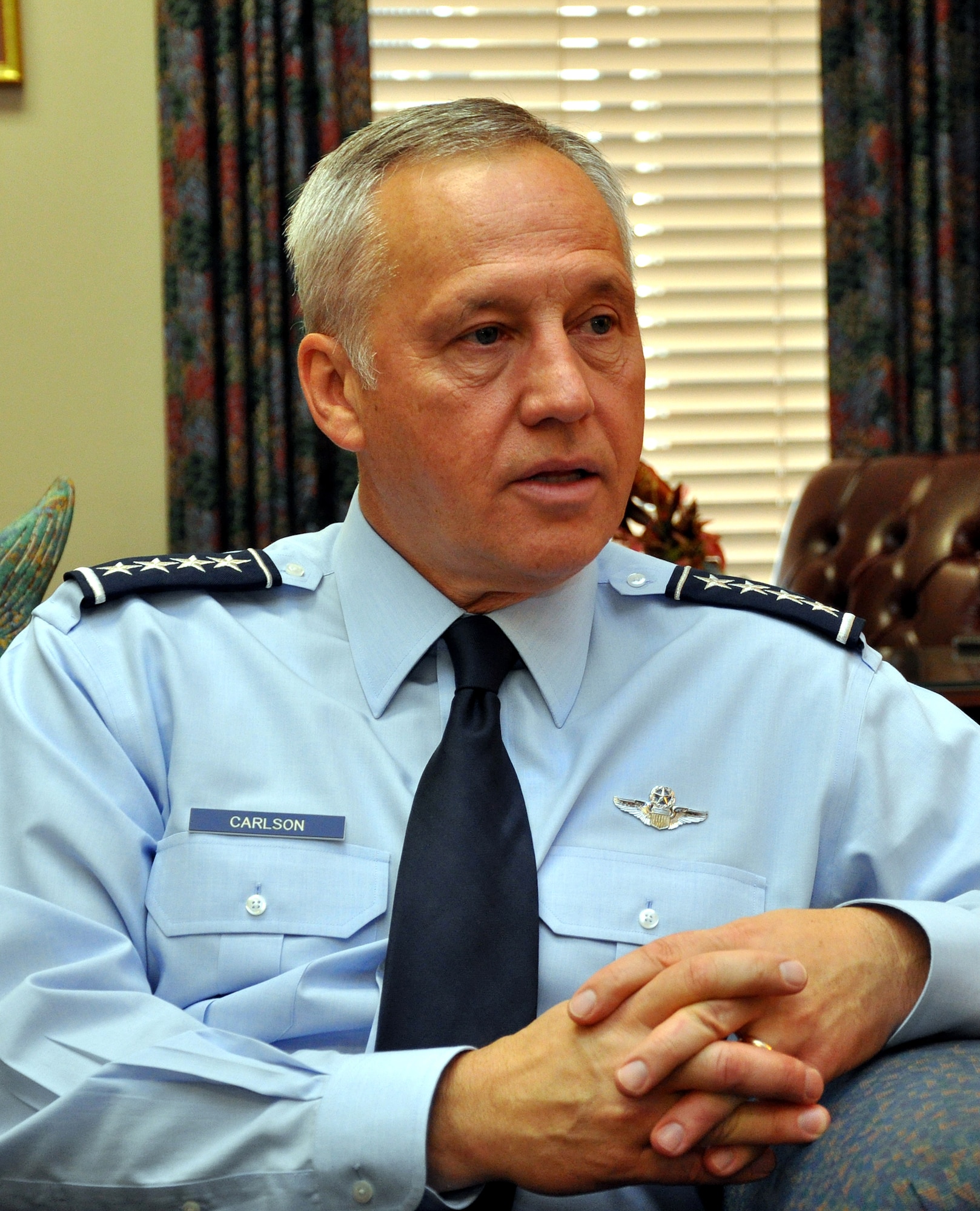 EGLIN AIR FORCE BASE, Fla. -- Gen. Bruce Carlson, Air Force Materiel Command commander, rests in a visitors lounge before moving on to brief attendees at the 34th Air Armament Symposium here. (U.S. Air Force photo by Tech. Sgt. Brian Jones) 