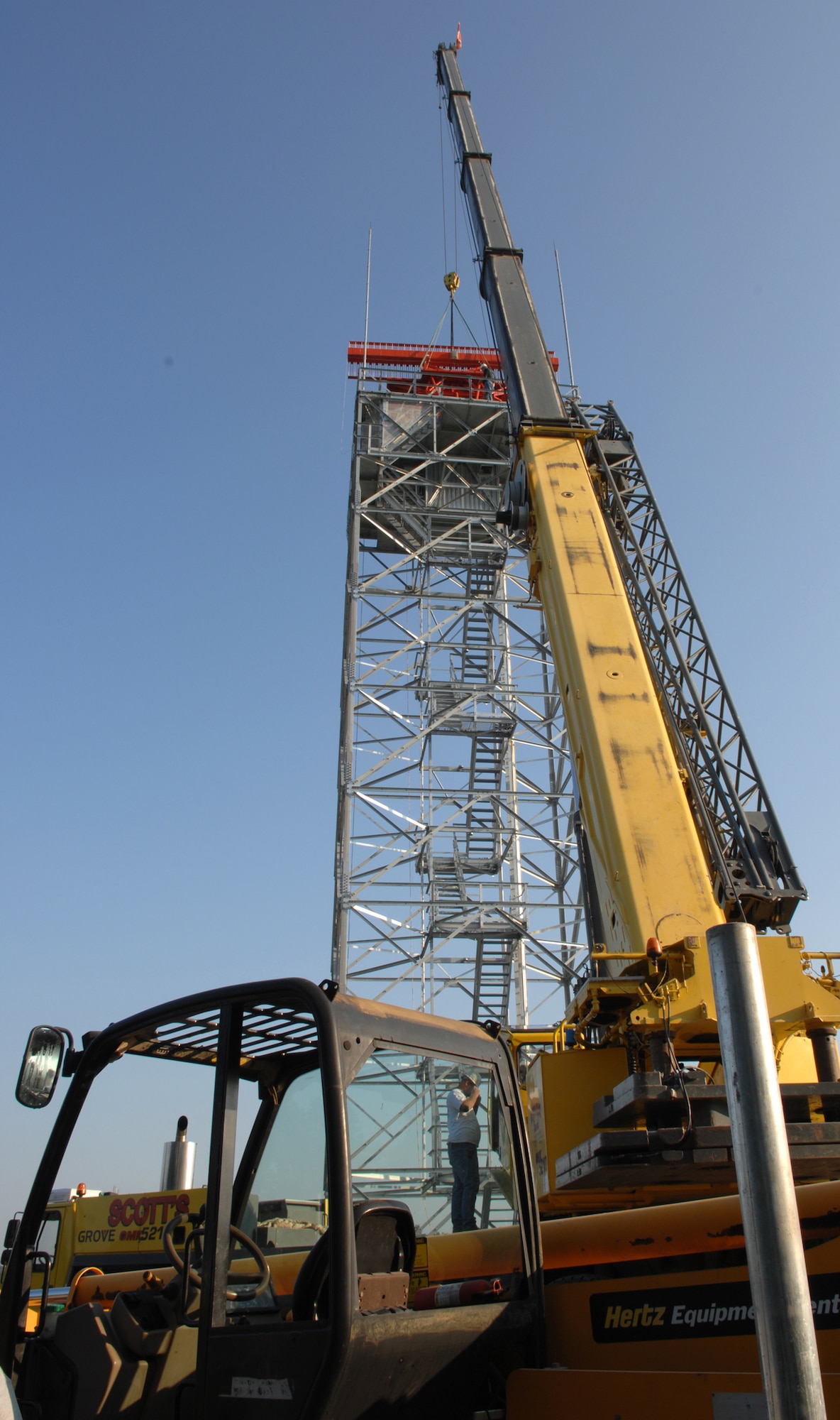 WHITEMAN AIR FORCE BASE, Mo. - Workers install a new radar system on base Sept. 26. This new radar system will improve reliability, provide additional weather data, reduce maintenance cost, improve performance and provide digital data to new digital automation systems for presentation on air traffic controller displays. (U.S. Air Force photo/Staff Sgt. Charles Larkin)