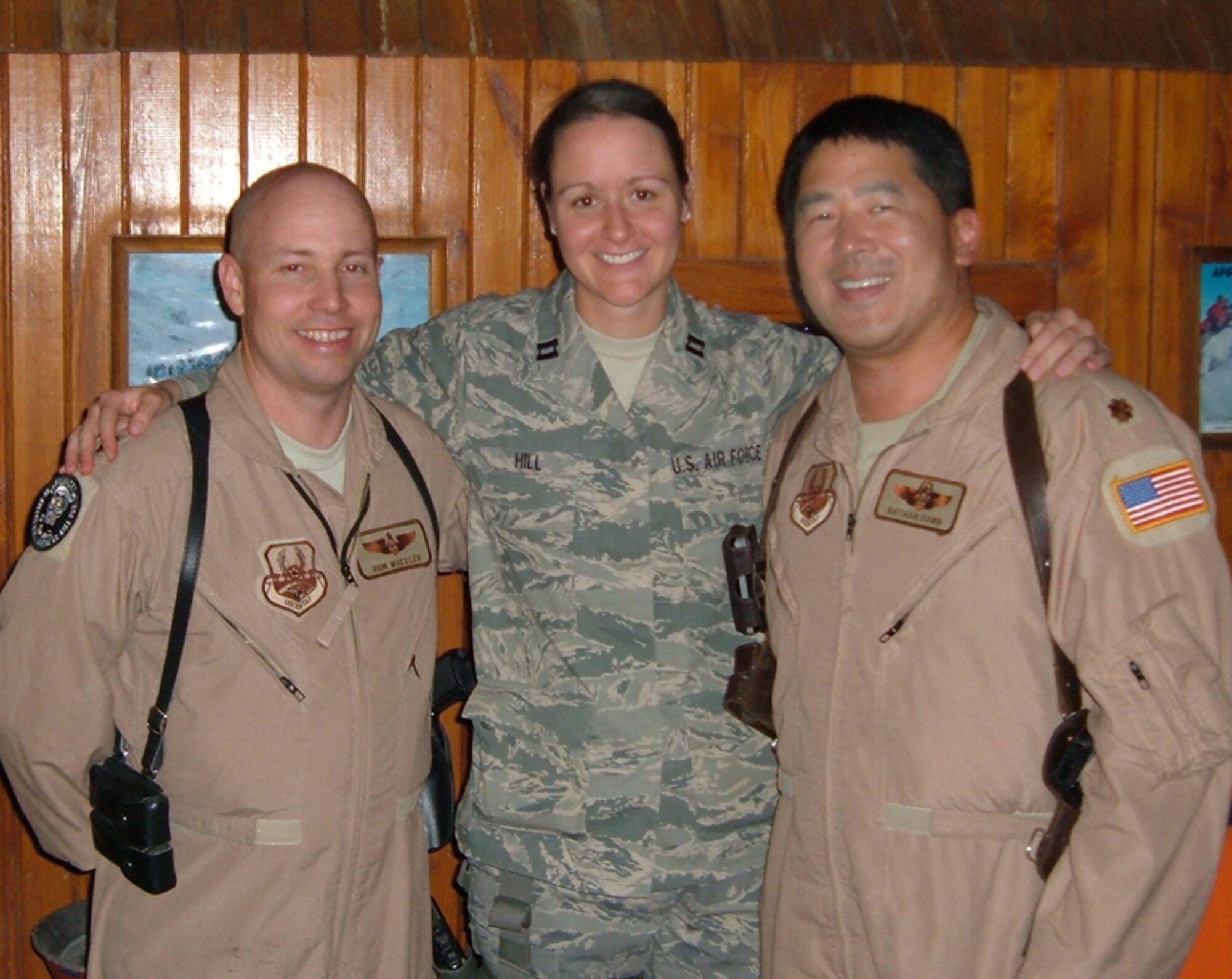Members of the 53d Test Management Group's Detachment 1 came together in Kabul, Afghanistan this month.  Each were serving separate tours, but came together for a reunion of sorts.  Det 1 located at Barksdale Air Force Base, La., handles test management for all B-52 testing accomplished in the 53d Wing.   The detachment currently has only five people assigned to it.  Left to right:  Maj. Ron "Wheels" Wheeler, 53 TMG Det 1 commander; Capt Mary "MJ" Hill, Det 1 test engineer and Maj. Nate “Plate” Dawn who will PCS to Det 1 after his remote assignment to Afghanistan. 