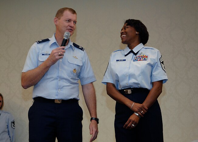Col. John "Red" Millander speaks about Command Chief Master Sgt. Bernice Belcer during her going away luncheon at Charleston AFB Oct. 6. Chief Belcer is leaving Charleston to become the 19th Air Force command chief at Randolph AFB, Texas. Colonel Millander is the 437th Airlift Wing Commander and Chief Belcer is the 437th Airlift Wing command chief. (U.S. Air Force photo/Airman 1st Class Katie Gieratz)