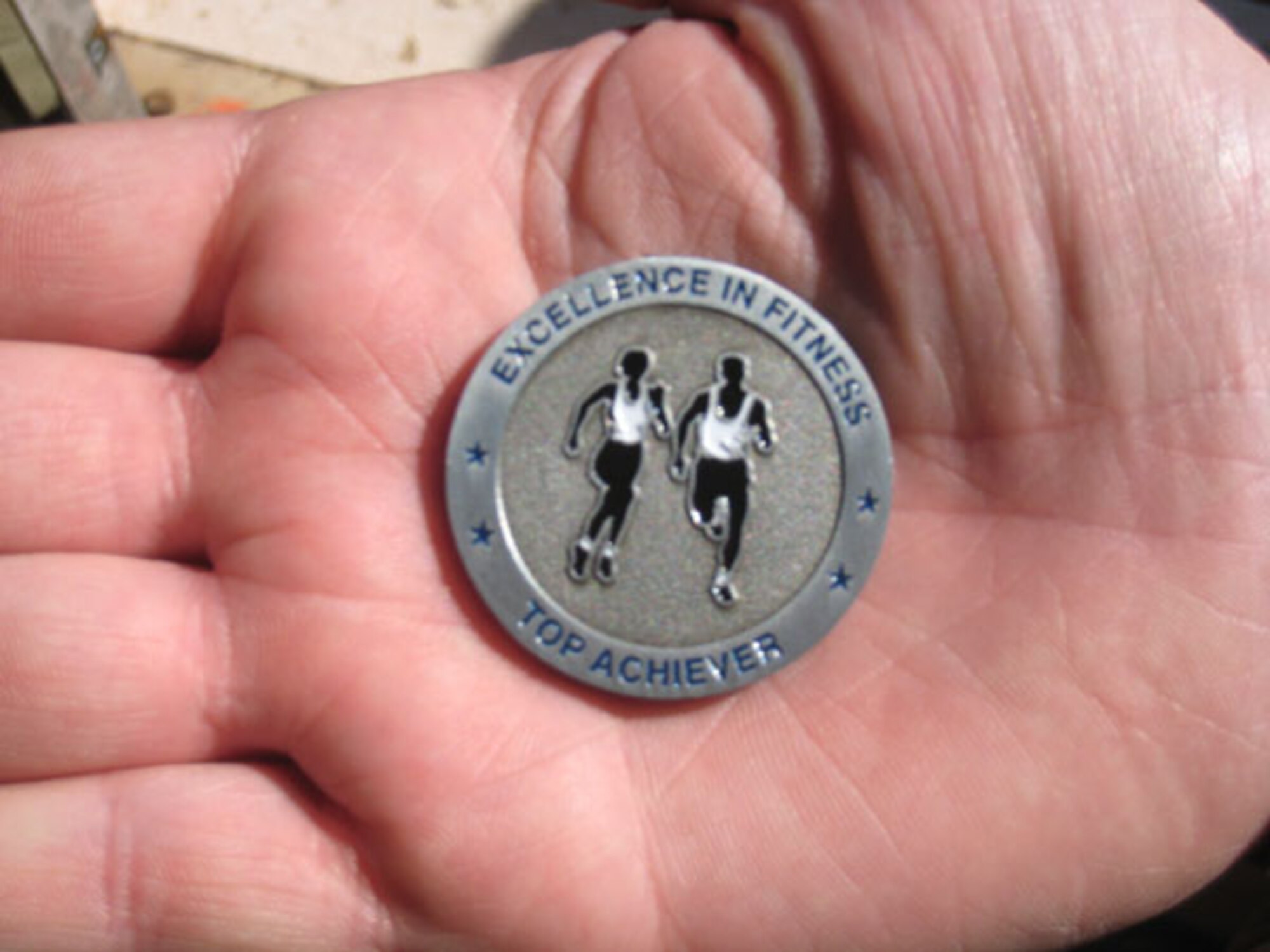 More than 50 507th Air Refueling Wing members have earned Fitness Coins during the past quarter.  This new coin was presented for the first time to 36 wing reservists during the wing commander's call. To be eligible to receive a fitness coin a wing member must not have any exempted testing areas and score 90 percent or better on their fitness test. 