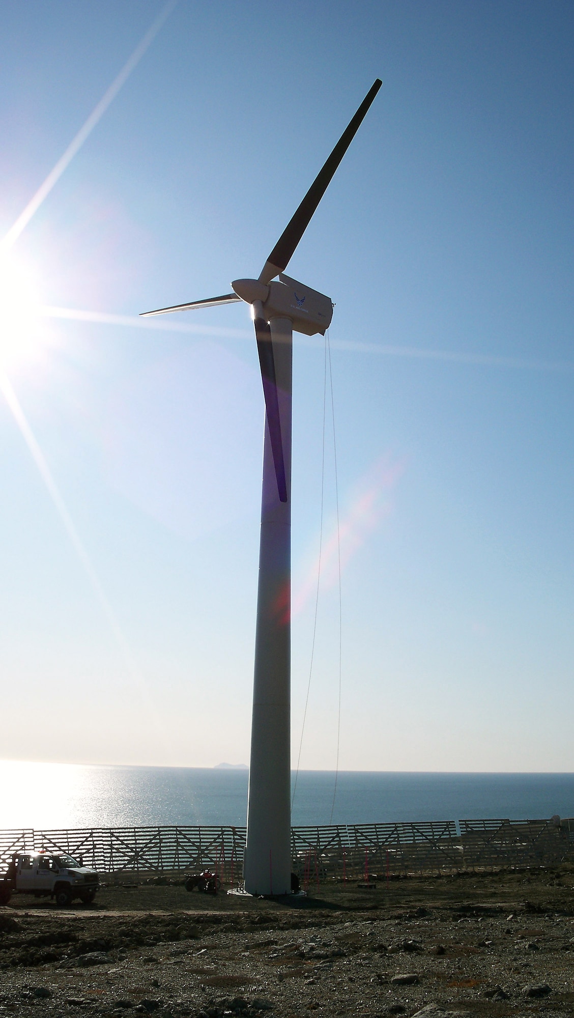 A wind turbine generator, towering more than 110 feet and with blades each 44 feet long, is being installed at the Tin City Long-Range Radar Station near Tin City, Alaska.  The generator will augment the existing diesel-fueled power system at the site.  (U.S. Air Force photo)