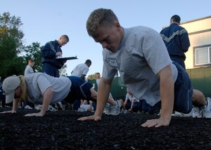 Cody Shields competes in the push-up portion of the Commander's Fitness Challenge Oct. 3 behind the Charleston AFB fitness center. Shields is with the 14th Airlift Squadron and completed 97 push-ups for the event. (U.S. Air Force photo/Airman 1st Class Timothy Taylor) 
