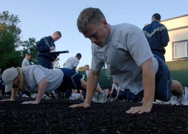 Cody Shields competes in the push-up portion of the Commander's Fitness Challenge Oct. 3 behind the Charleston AFB fitness center. Shields is with the 14th Airlift Squadron and completed 97 push-ups for the event. (U.S. Air Force photo/Airman 1st Class Timothy Taylor) 