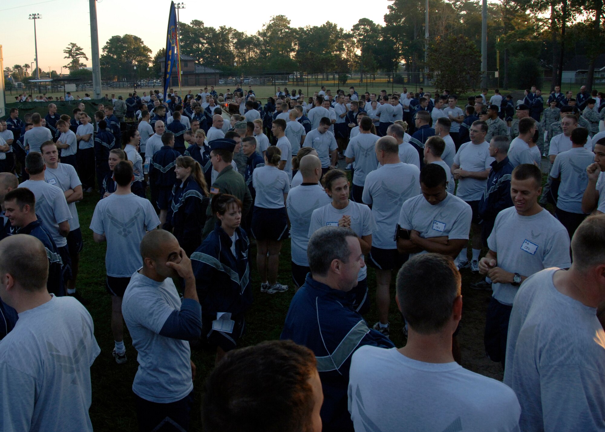 Charleston Airmen from various squadrons and groups gather behind the base fitness center to participate in the Commander's Fitness Challenge Oct. 3. The Commander's Fitness Challenge consisted of push-ups, sit-ups and a 1.5-mile run ending with the top two teams competing in tug-of-war to determine the first place winners. (U.S. Air Force photo/Airman 1st Class Timothy Taylor) 
