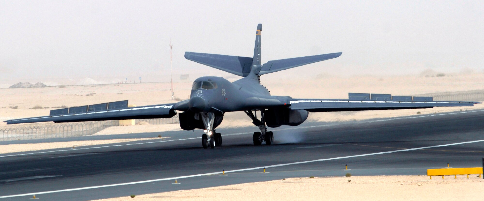 A B-1B Lancer goes full flaps and hits the brakes to stop after completing another combat mission recently. The B-1B is deployed from Ellsworth Air Force Base, S.D., to an undisclosed air base in support of Operations Iraqi and Enduring Freedom.  (U.S. Air Force photo/Tech. Sgt. Michael Boquette)