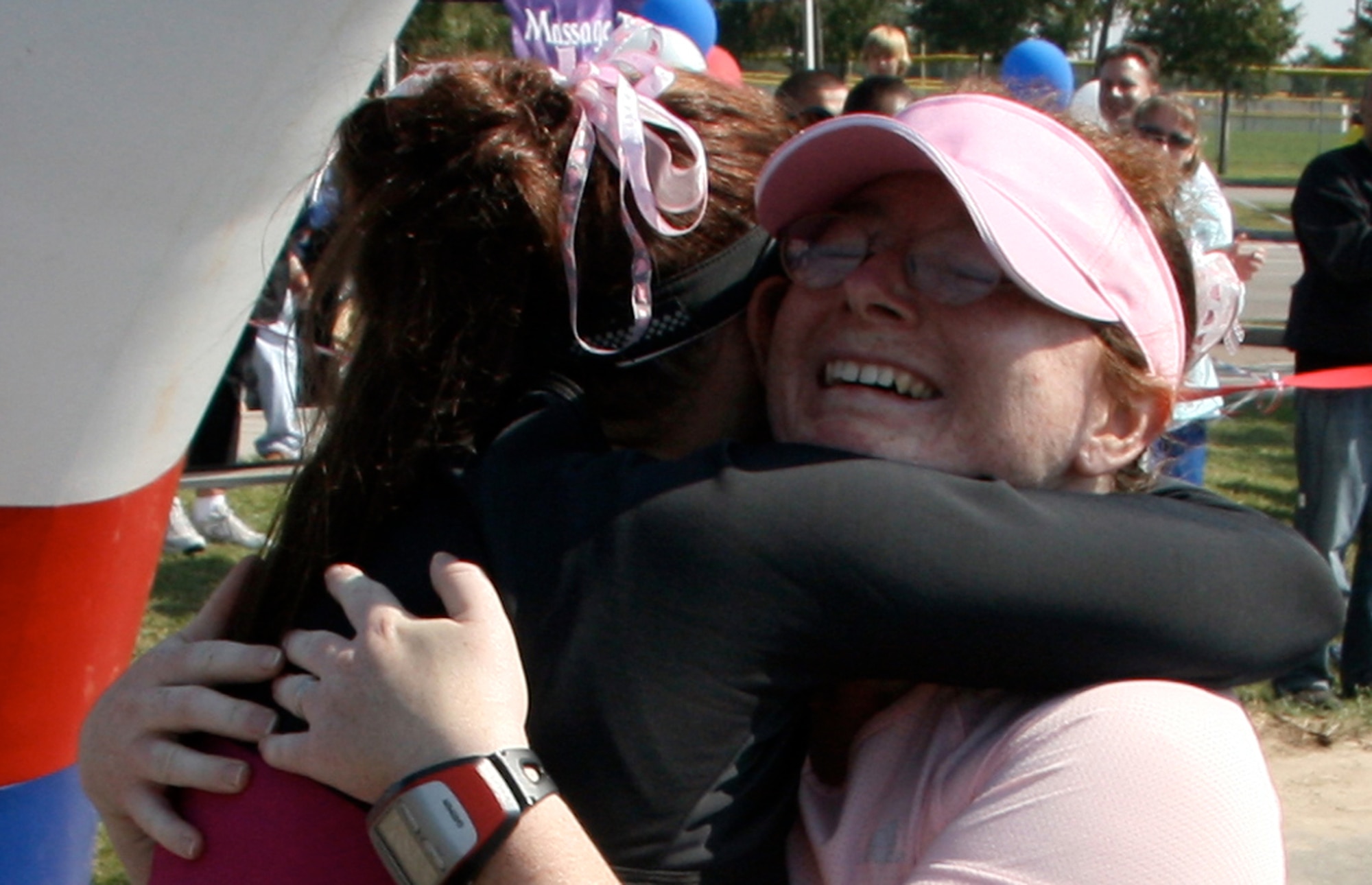 Tech. Sgt. Angel Rios, 100th Force Support Squadron NCOIC of fitness programs, hugs Master Sgt. Sarah Webb, 100th Air Refueling Wing Public Affairs, after crossing the finish line at the 2nd annual Aviano Air Base Marathon in Italy.

“The best part of the race was everything!” said Rios. “My primary goal was just to cross that finish line."

According to Rios, “finishing was the result of months of research, training and soreness from training. I ran and finished my first race with the support of my fantastic husband, family and friends”. 

So what’s next on  her agenda? The 2009 Disney World Marathon. She wants to finish in under 5 hours for a new PR and then go get one big hug from Micky. (U.S.Air Force photo)