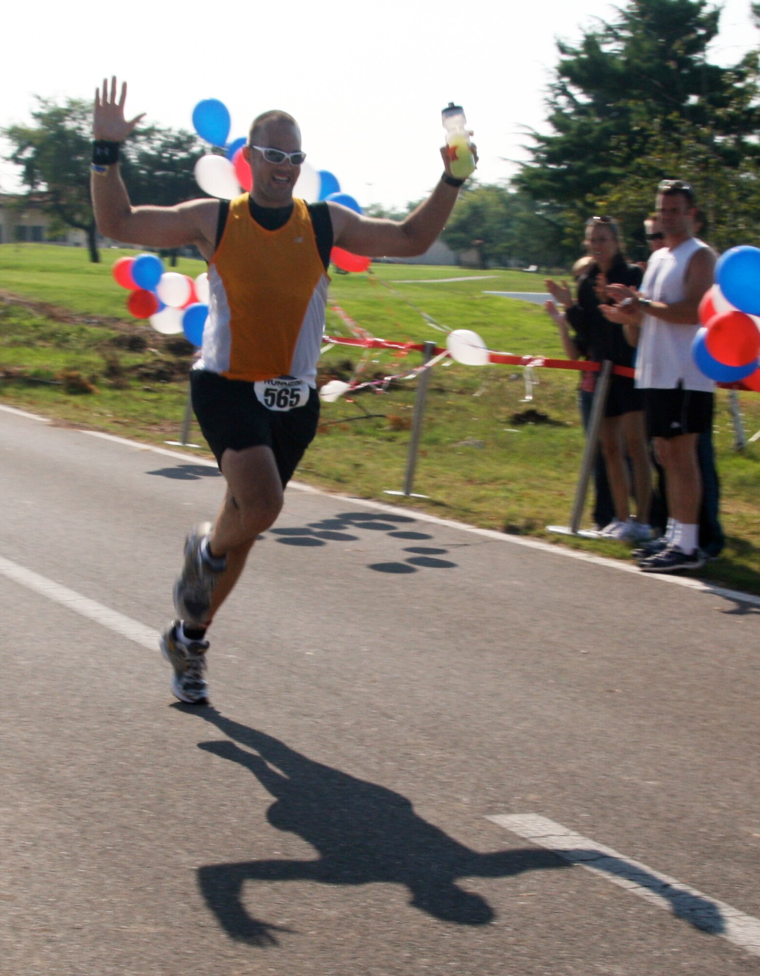 Staff Sgt. Brian Morris, 488th Intelligence Squadron, crosses the finish line to win first place at the Aviano Air Base 2nd Annual Marathon in Italy. Morris finished the race laying down a huge personal record in 3:19.50. His pre-race plan was to average an eight-minute mile for a finishing time of 3:28.00 and setting a new marathon PR.  

“Between feeling pumped up and running a relatively flat course, I exceeded my goal,” said Morris. “The best part of the race was being able to travel to Aviano. I had the opportunity to visit with some old friends, meet new friends who share my passion for endurance sports and share in Tech. Sgt. (Angel) Rios’ first marathon finish.  And having the Aviano Air Base commander thank Master Sgt. Sarah Webb and I for taking two of their first place medals away from them was fun too."

As for what’s next on his agenda his long term goal is to continue swimming, cycling and running in preparation for Ironman Austria that will take place in Klagenfurt, Austria on July 5th 2009.   

