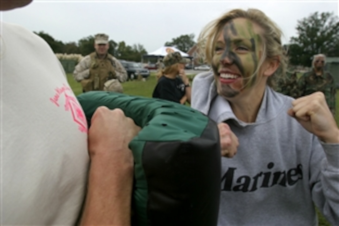 A U.S. Marine spouse punches a martial arts pad during the U.S. Marine Corps Forces, Special Operations Command, Marine Special Operations Support Group Jane Wayne Day in front of the Goettge Field House on Camp Lejeune, N.C., Sept. 24, 2008.
