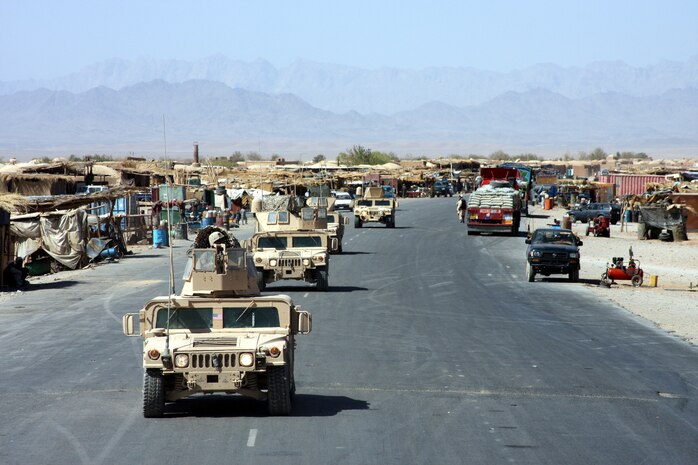 Marines assigned to Company G, Task Force 2d Battalion, 7th Marine Regiment, Special Purpose Marine Air Ground Task Force Afghanistan, convoy through Bala Baluk, Afghanistan. The Marines were deployed earlier this year to conduct counterinsurgency operations with an emphasis on police training in support of Operation Enduring Freedom.