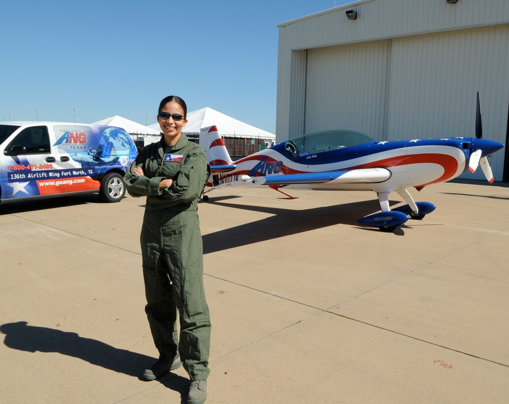 Air Force Tech Sgt Nora Castro, 136th Mission Support Flight, Texas Air National Guard, prepares to fly with John Klatt, stunt pilot for the Air National Guard over Alliance Airport as part of the Recruiting and Retention 2008 Air Show in North Texas. October 8, 2008 (USAF photo by Senior Master Sgt Elizabeth Gilbert)