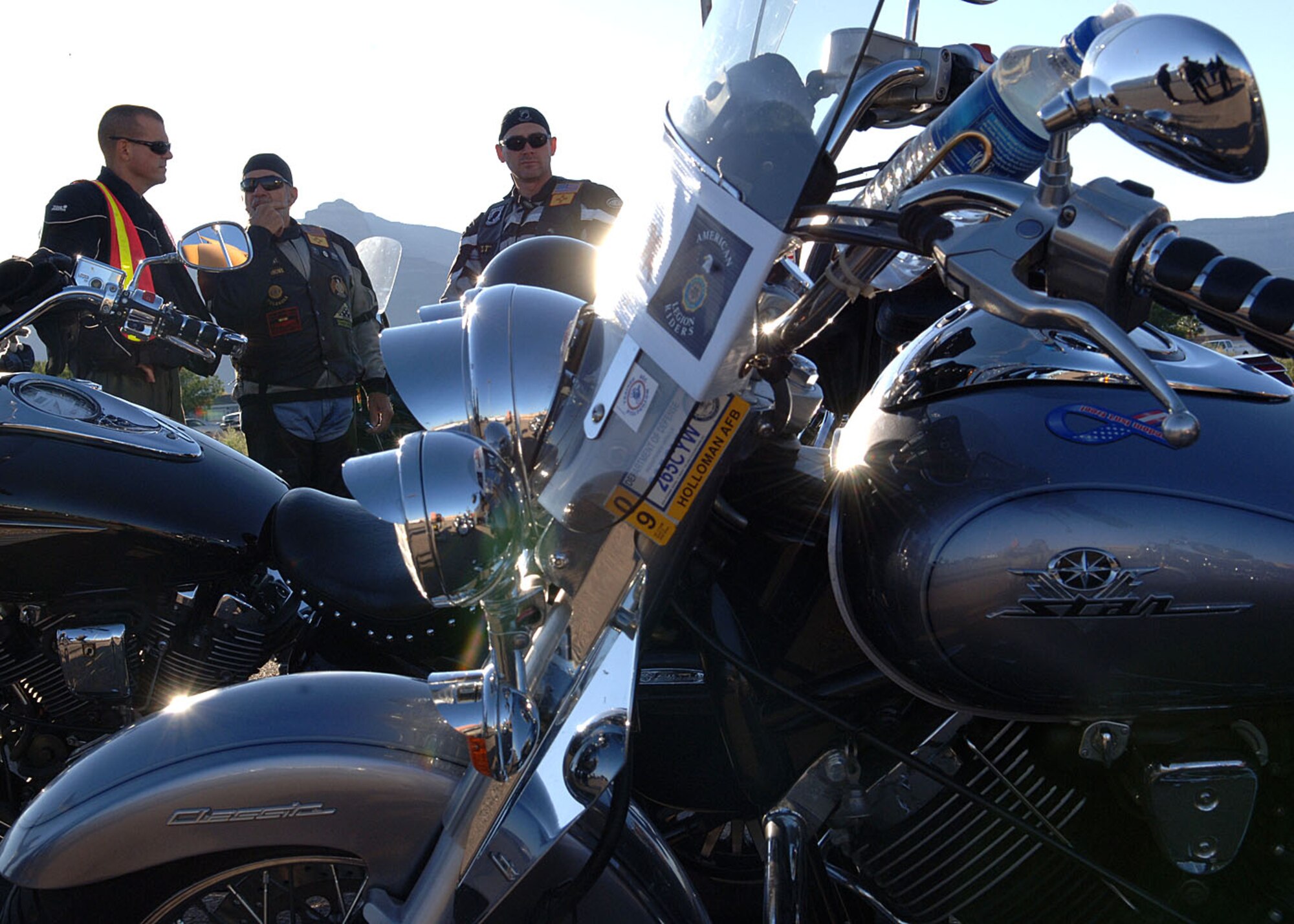 Col. Michael McGee, 49th Fighter Wing vice commander and Mr. Ed Summerall , American Legion Riders Chapter 8 Post 108 president, converse while 1st Lt. Brent Smith, 49th Force Support Squadron, looks on at the motorcycles, October 7, in Alamogordo, N.M.  Lieutenant Smith is a member of the American Legion Riders Chapter 8 Post 108.  (U.S. Air Force photo by Airman 1st Class John D. Strong II)