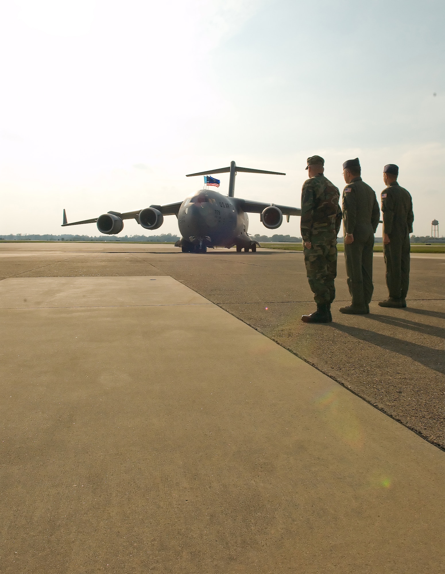 (Left) Chief Master Sgt. John Wood, 436th Airlift Wing command chief, Col. Randal Bright, 512th AW commander, and Col. Steven Harrison, 436th AW commander, welcome Dover's newest C-17 Globemaster III, The Spirit of Delaware, during a ceremony at the Air Mobility Command Museum Oct. 8.  (U.S. Air Force photo Roland Balik)