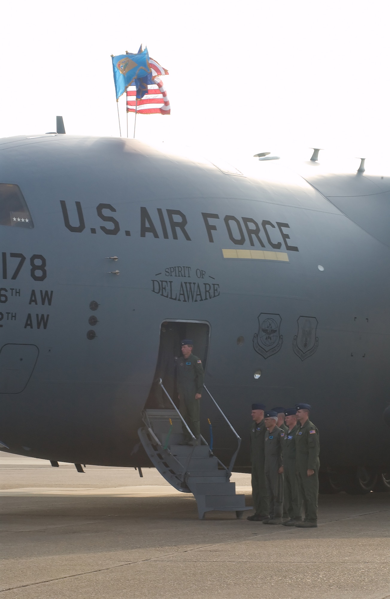 The delivery crew for Dover's 13th and final C-17 Globemaster III stands at attention during the arrival ceremony at the Air Mobility Command Museum Oct. 8.  Gen. Arthur Lichte, AMC commander, served as the delivery official for The Spirit of Delaware, Dover's last assigned C-17.  (U.S. Air Force photo Tom Randle)