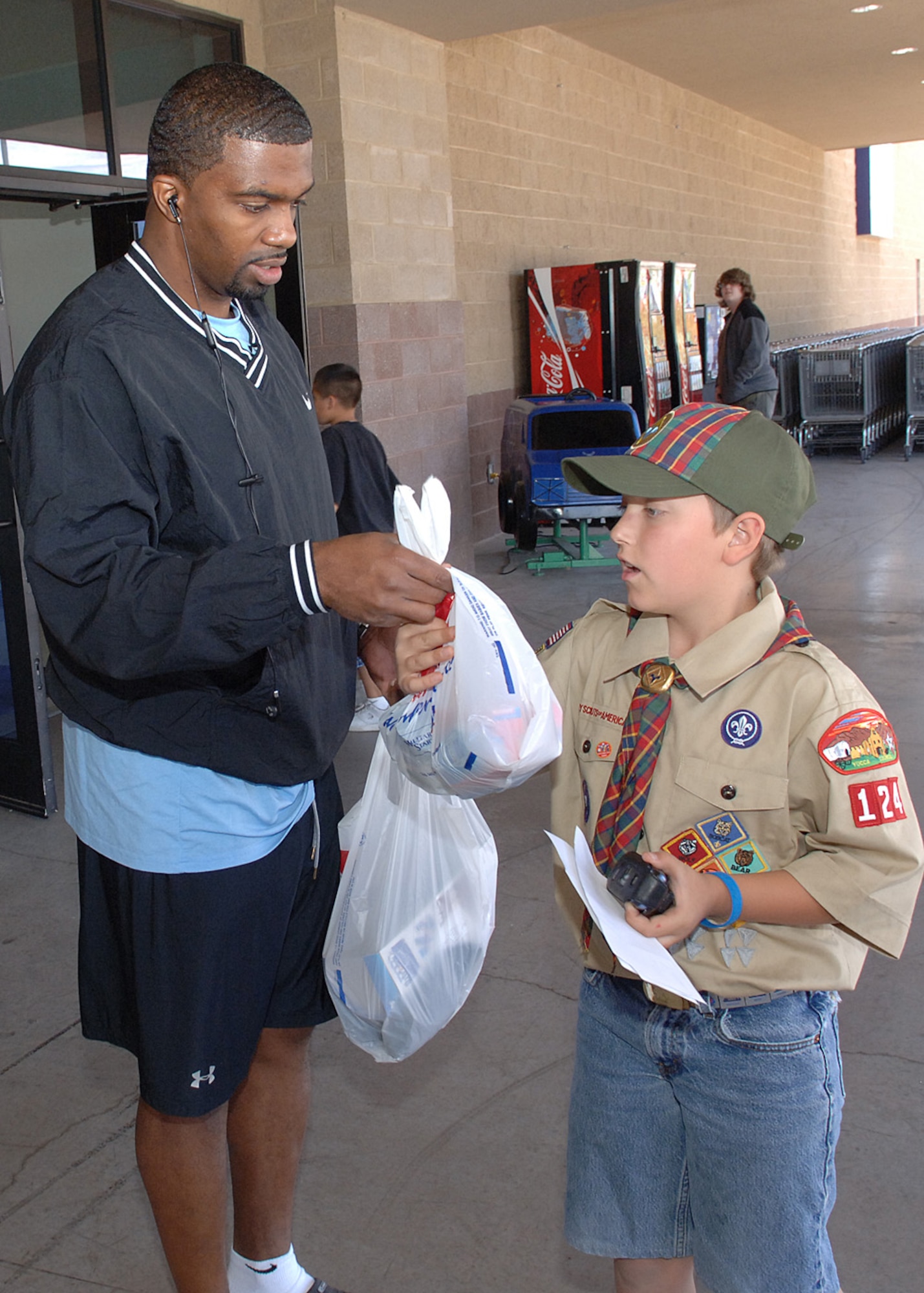Brayden Consley, Cub Scout Pack 124, receives a donation for Operation Wounded Warrior, September 27, at Holloman Air Force Base, N.M.  (U.S. Air Force photo / Airman 1st Class John D. Strong II)