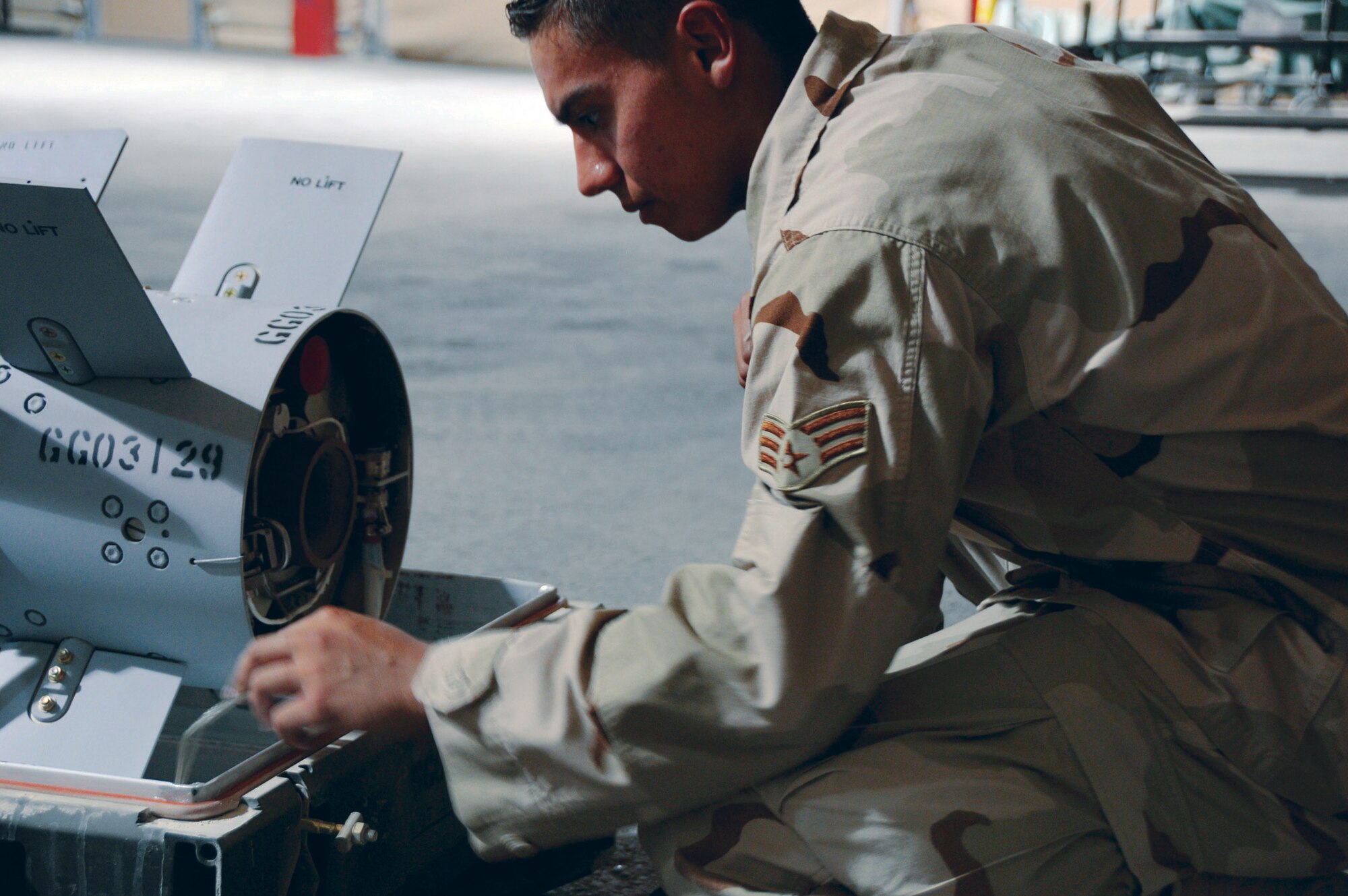 Senior Airman Anthony Bonillo checks the ignition fuse the AGM-65 missile in Southwest Asia recently. Checking the fuse is one of the critical steps in a visual inspection of a missile. Airman Bonilla is assigned to the 379th Expeditionary Maintenance Squadron, a native of Brooklyn, N.Y., and is deployed from Nellis Air Force Base, Nev. (U.S. Air Force photo/Tech. Sgt. Michael Boquette)