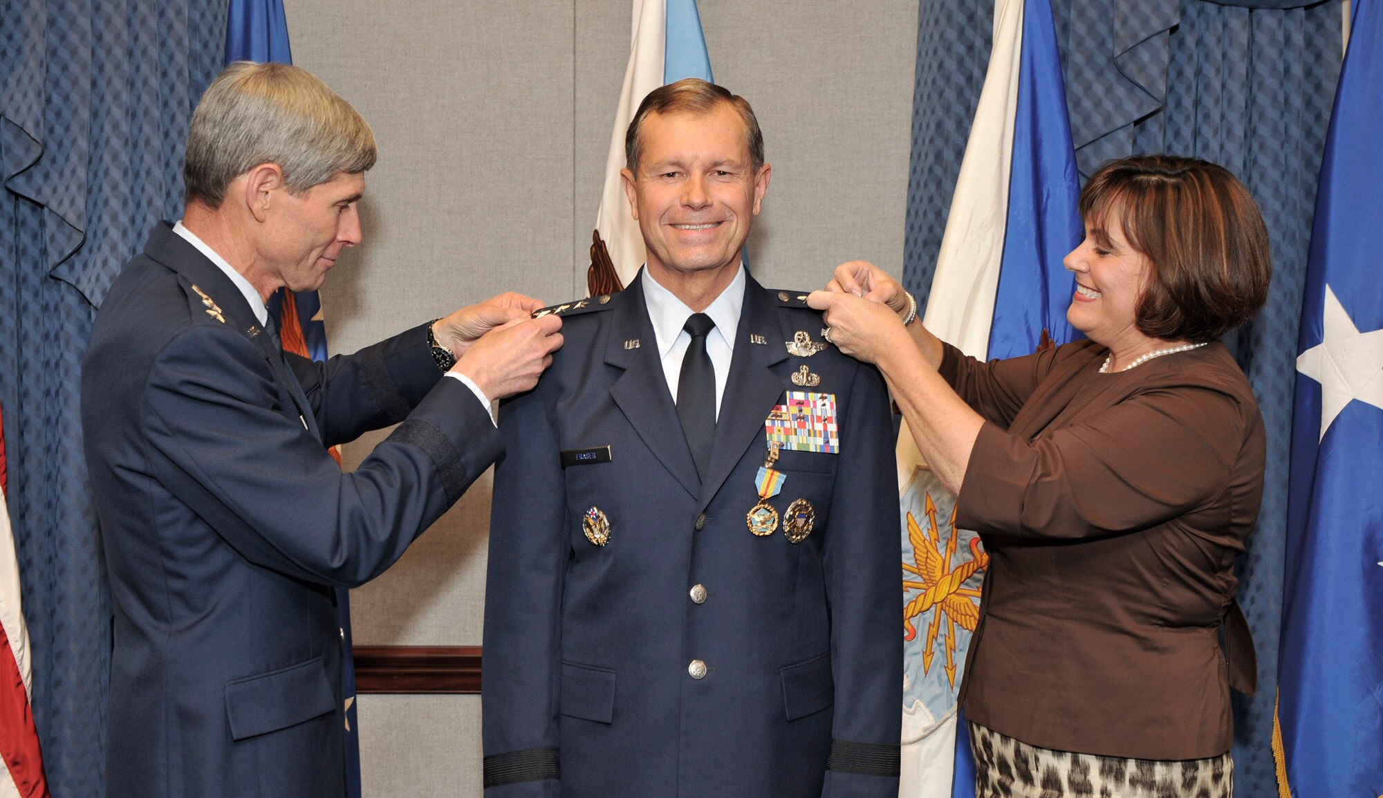 Air Force Chief of Staff Gen. Norton Schwartz and Mrs. Bev Fraser pin the fourth star on Vice Chief of Staff Lt. Gen. William Fraser during a promotion ceremony Oct. 8 in the Pentagon. Along with his selection as vice chief came the promotion to full general.  (U.S. Air Force photo/Michael Pausic)