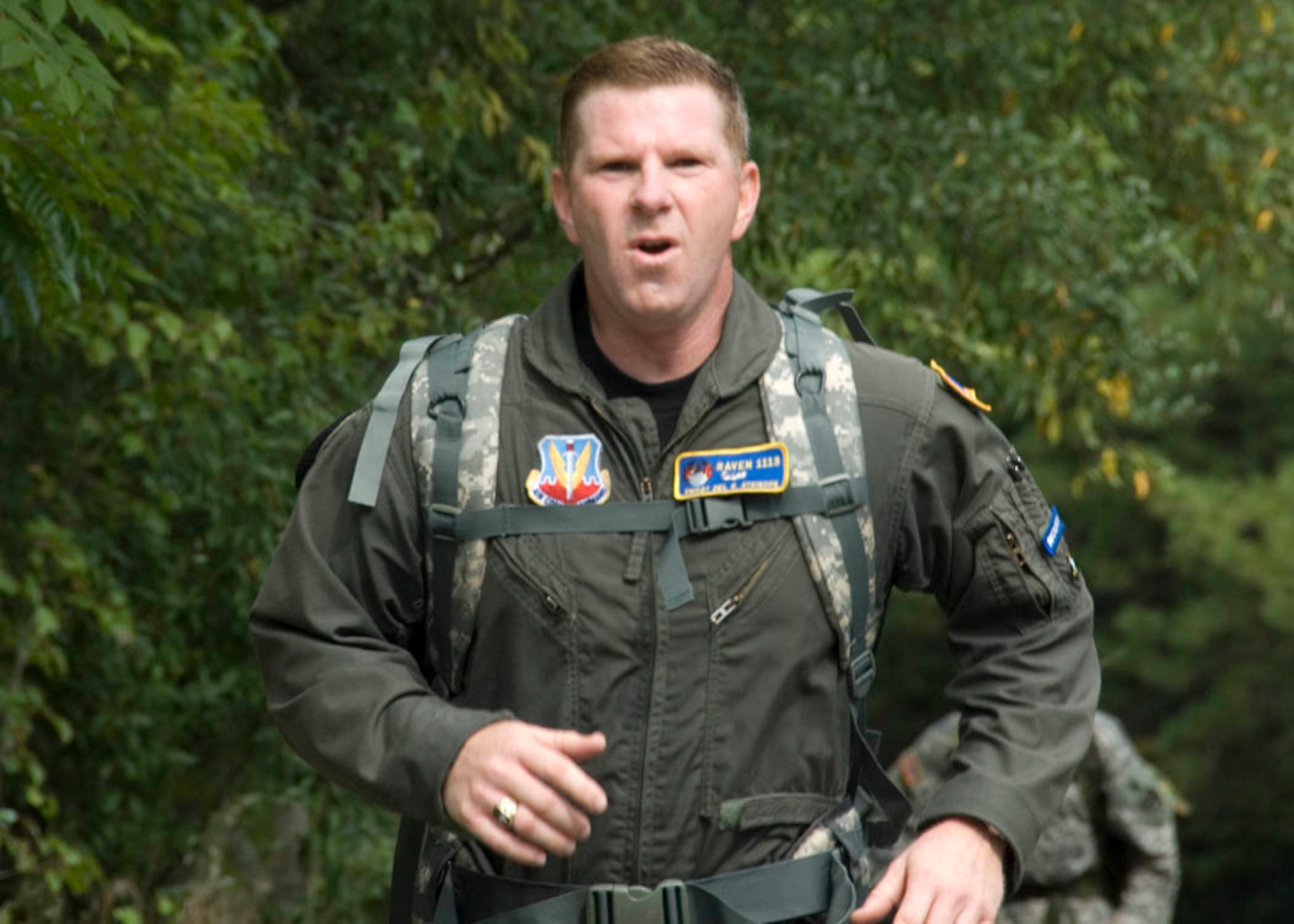 Senior Master Sgt. Del Atkinson, 113th Security Forces Squadron Phoenix Raven program manager, sprints to the finish line during the road march in Reston, Va., coming in fourth place out of 166 participants with a run time of 3 hours and 20 minutes Oct. 1.  The sergeant is working to achieve the German Armed Forces, Troop Duty Proficiency Badge.  (USAF photo by Tech. Sgt. Adrianne M. Wilson)