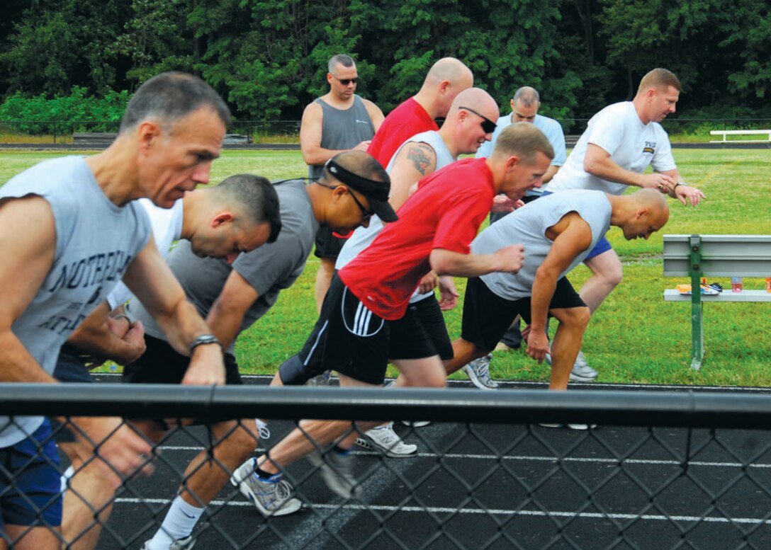 Members of the Army National Guard and D.C. Air National Guard begin their 1.85 mile run Aug. 27 at Falls Church Valley High School, Falls Church, Va.  The run is one of eight physical activities participants competed in to receive the German Armed Forces, Troop Duty Proficiency Badge; events which include shot-put, long-jump, sprint, and run.  (USAF photo by Tech. Sgt. Adrianne M. Wilson)