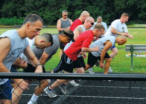 Members of the Army National Guard and D.C. Air National Guard begin their 1.85 mile run Aug. 27 at Falls Church Valley High School, Falls Church, Va.  The run is one of eight physical activities participants competed in to receive the German Armed Forces, Troop Duty Proficiency Badge; events which include shot-put, long-jump, sprint, and run.  (USAF photo by Tech. Sgt. Adrianne M. Wilson)