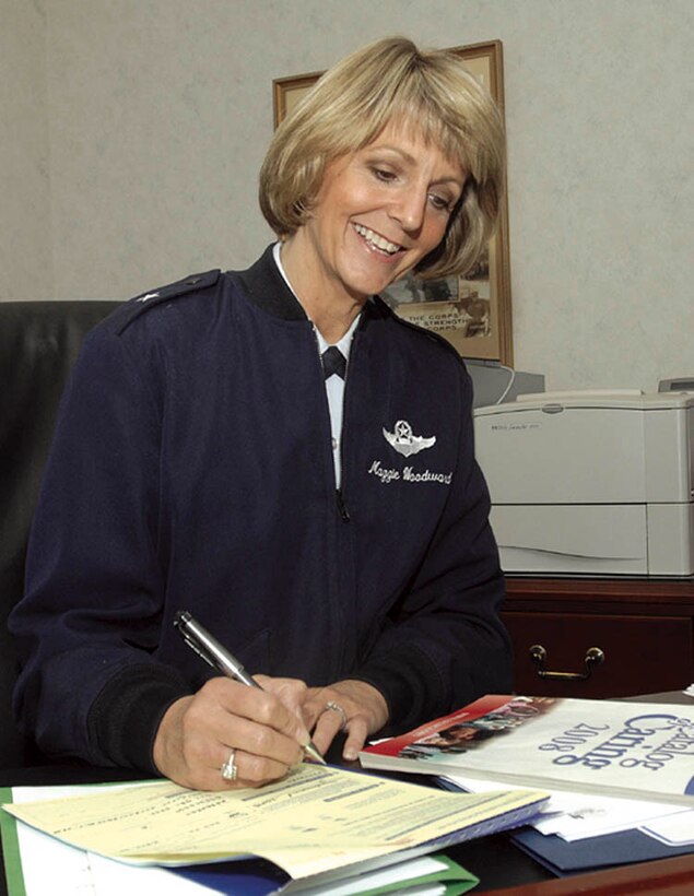 Brig. Gen. Margaret Woodward, 89th Airlift Wing commander, fills out a Combined Federal Campaign form, making donations to her selected charities. (USAF photo by Senior Airman Renae L. Kleckner)