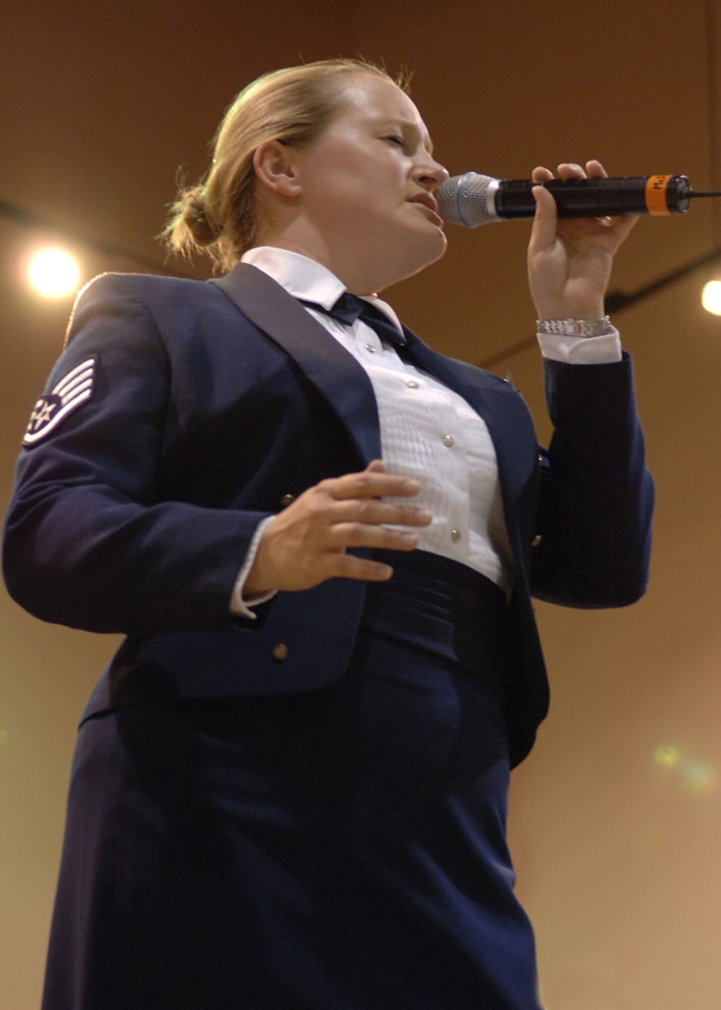 Staff Sgt. Mary Beth McFann, vocalist in the Air Force Band of the West, performs a solo during the Air Force Band of the West concert, October 6 at the Tay's Center in Alamogordo, N.M.   Sergeant McFann was also the narrator for Casey at the Bat during the performance.  (U.S. Air Force photo by Airman 1st Class John D. Strong II)