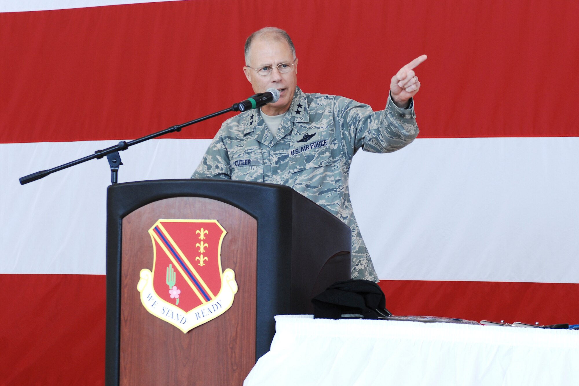 Major General Thomas Cutler, Michigan's Adjutant General, addresses the crowd at a ribbon cutting ceremony for the Michigan Army National Guard's new Chinook Hangar at Selfridge Air National Guard Base.  General Cutler told the audience that the young unit had "certainly earned these state of the art facilities."  While in Iraq in 2004-2005, the unit, which had been formed in 2002, flew approximately 6000 hours, transported 45,000 military and civilian personnel and transported about 14 million pounds of cargo.  