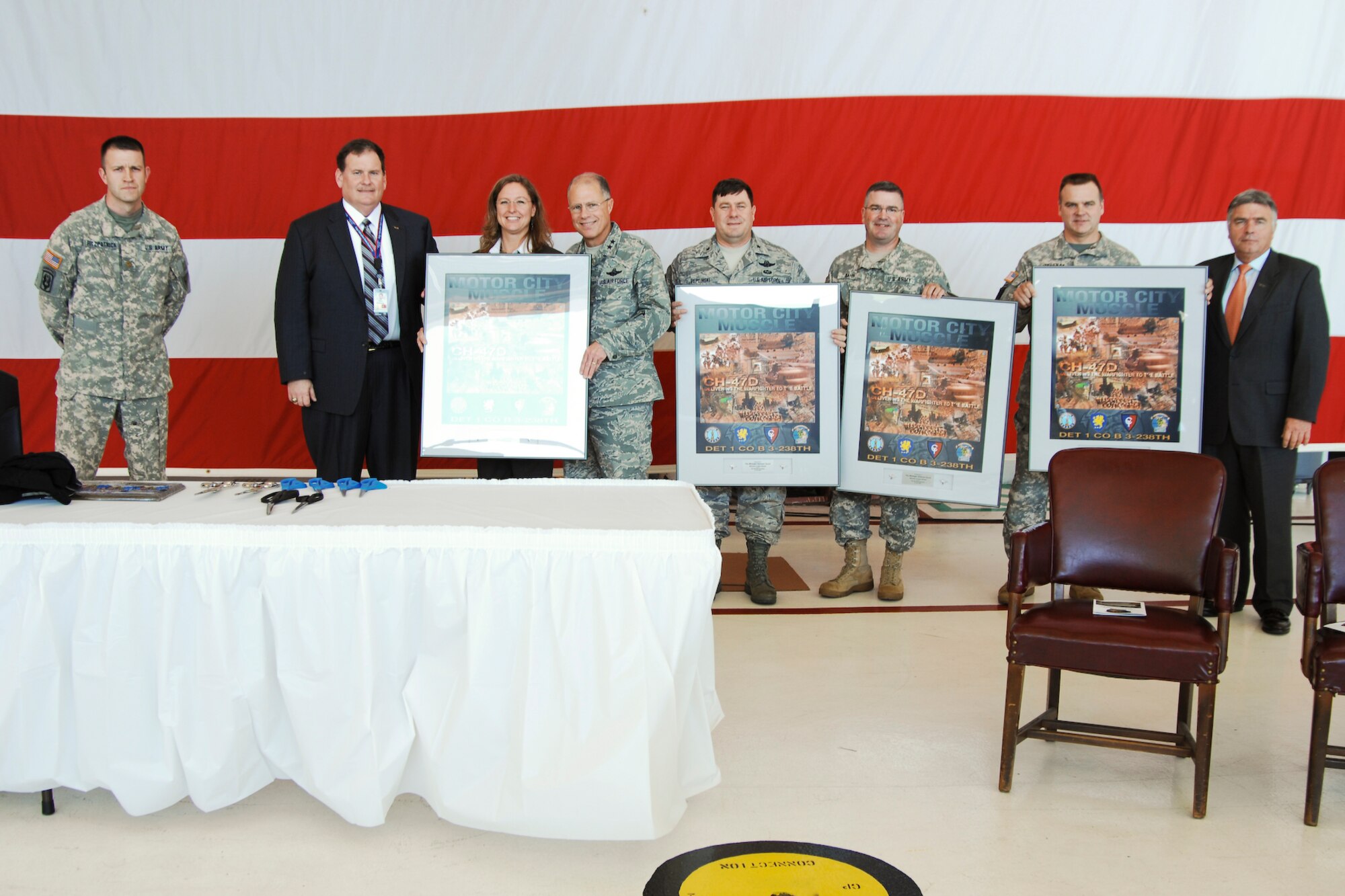 Boeing representatives presented their traditional unit poster to senior leaders present at a Ribbon Cutting ceremony marking the official acceptance of Hangar 1416 by Detachment 1, Bravo Co. 3-328th Aviation Regiment, at Selfridge Air National Guard Base.  The Michigan National Guard gratefully recognized Boeing, Inc. partners who continually upgrade Chinook features in order to provide successive product improvements. Boeing's commitment to quality aircraft and meeting the challenging requirements of the National Guard prove their dedication to preserving American ideals. 
