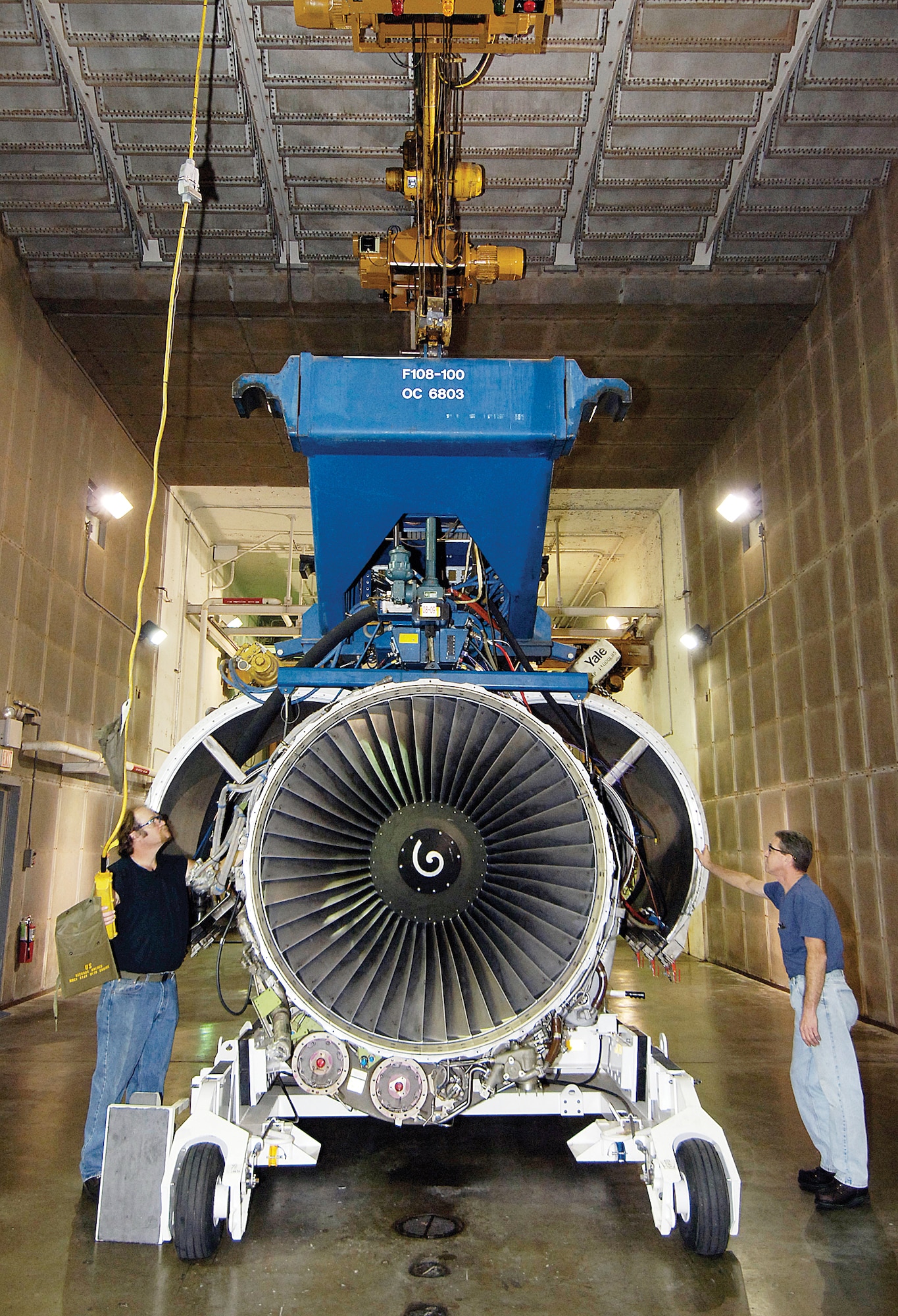 Wars aren’t fought from 8 to 5 and Tinker workers keep producing engines and aircraft through the night to meet the war fighters’ needs. An F108-200 engine is moved by operators Steve Marlett, left, and William LeRoy after testing at the engine test cell of the 76th Propulsion Maintenance Group. The men prefer working in the quieter night hours that offers less traffic hassles and frees up days for appointments. (Air Force photo/Margo Wright)