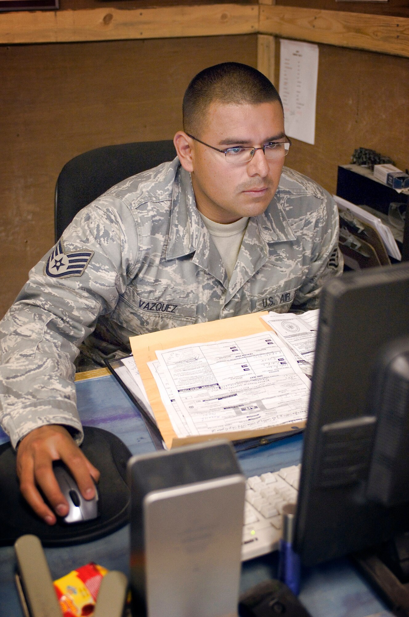 Staff Sgt. Arnoldo Vazquez prepares documents on truck drivers and supplies coming in the next day to Forward Operating Base Salerno, Afghanistan, recently. As part of the surface military cargo team, Sergeant Vazquez searches and processes every supply truck entering and exiting the FOB. Sergeant Vazquez is deployed from Eielson Air Force Base, Alaska, and is a traffic management craftsman. (U.S. Air Force photo/Staff Sgt. Rachel Martinez)