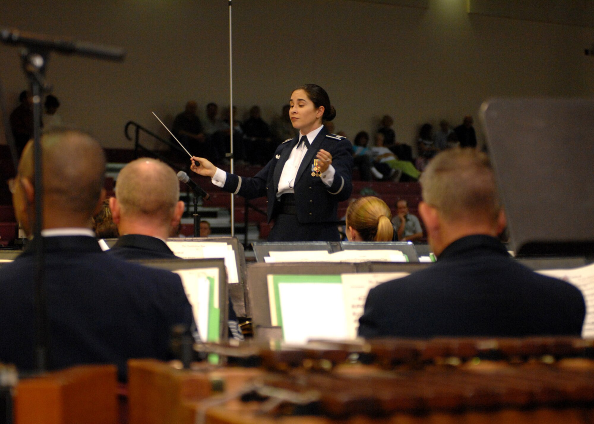 Captain Cristina Urrutia, commander and conductor of the U.S. Air Force Band of the West, leads the musicians at the Tay's Special Events Center in Alamogordo, N.M., October 6. Airmen came all the way from Lackland Air Force Base, Texas, to perform musical melodies for all military and civilians to enjoy. (U.S. Air Force photo/Airman 1st Class Veronica Salgado)