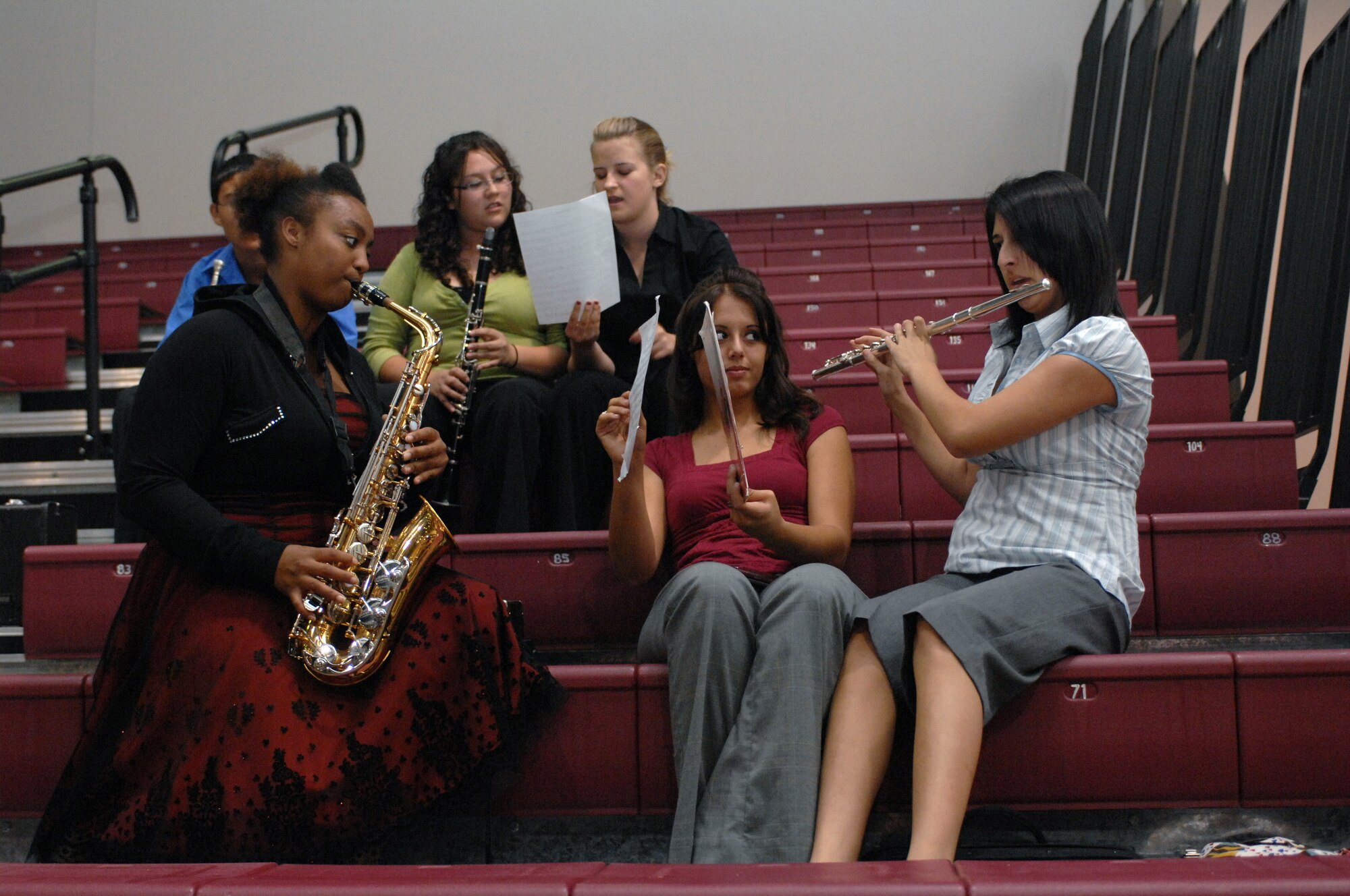 Saxophone player, Tatiana Jones, rehearses her music alongside flute player, Caitlyn Delgado, at the Tay's Special Events Center in Alamogordo, N.M., October 6. Band members from Alamogordo High School performed in concert with the Air Force Band of the West. (U.S. Air Force photo/Airman 1st Class Veronica Salgado)
