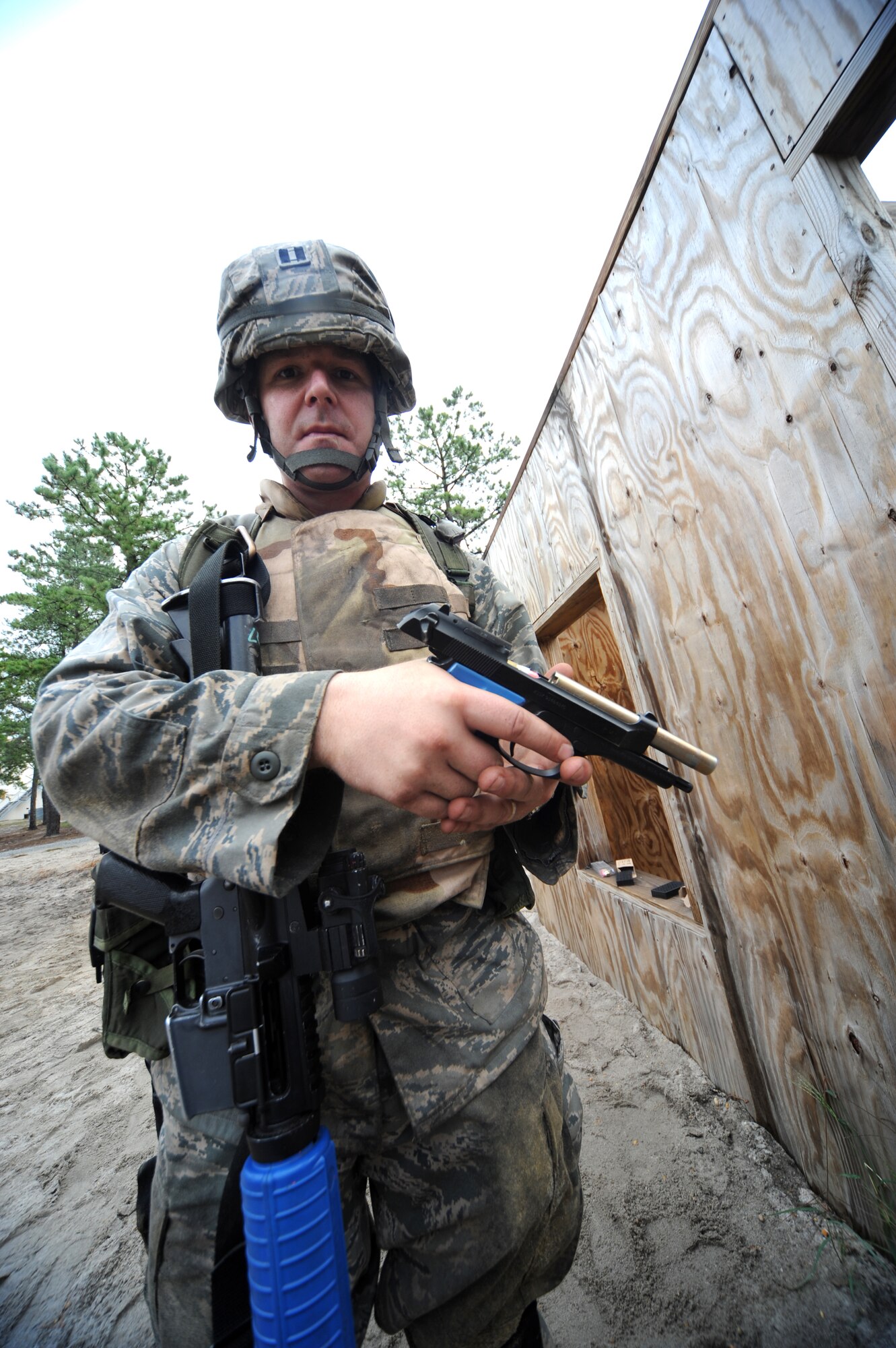 Capt. Aubrey Davis, from the Air Force Special Operations Command legal office at Hurlburt Field, Fla., partcipates in functional-specific training for the Air Force legal career field on a Fort Dix, N.J., range Oct. 1, 2008.  The functional-specific training for the students of the Air Force legal career field focuses on contingency skills basics, rules of use of force, rules of engagement and expeditionary basics for legal Airmen on deployment. The training is held for three days prior to them attending the Advanced Contingency Skills Training Course taught by the U.S. Air Force Expeditionary Center's 421st Combat Training Squadron on Fort Dix.  (U.S. Air Force Photo/Staff Sgt. Nathan Bevier)