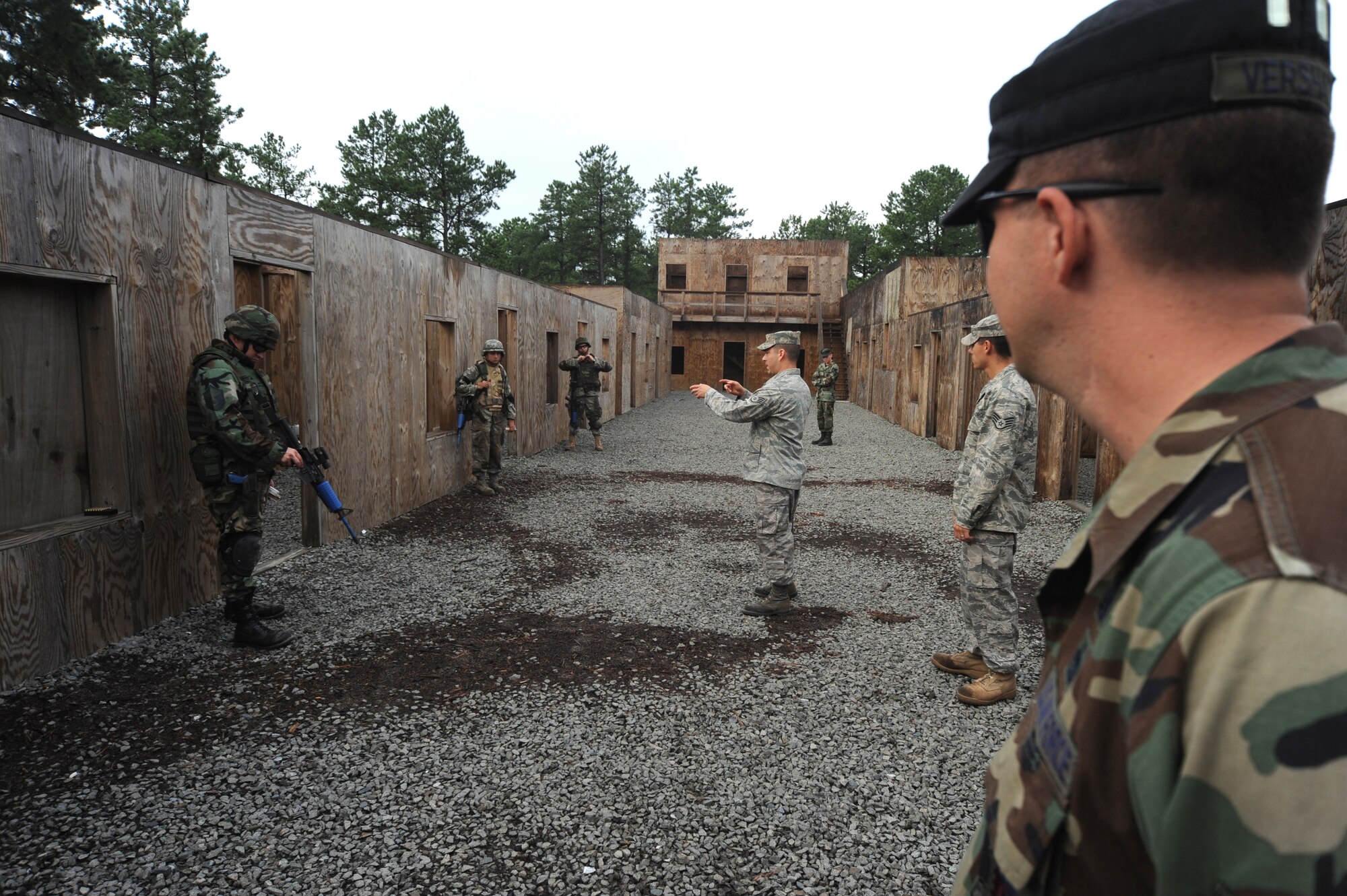 Tech. Sgt. Keith Vershay, U.S. Air Force Expeditionary Center contingency skills training instructor and an Air Force paralegal, oversees students partcipate in functional-specific training for the Air Force legal career field on a Fort Dix, N.J., range Oct. 1, 2008.  The functional-specific training for the students of the Air Force legal career field focuses on contingency skills basics, rules of use of force, rules of engagement and expeditionary basics for legal Airmen on deployment. The training is held for three days prior to them attending the Advanced Contingency Skills Training Course taught by the U.S. Air Force Expeditionary Center's 421st Combat Training Squadron on Fort Dix.  (U.S. Air Force Photo/Staff Sgt. Nathan Bevier)